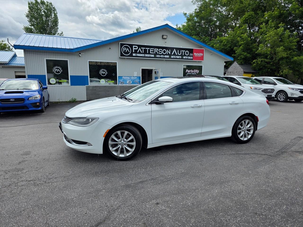 This 2015 Chrysler 200C is a well-equipped midsize sedan powered by a smooth 3.6L Pentastar V6 with front-wheel drive. This top-line C trim comes loaded with heated leather seats, remote start, dual-zone automatic climate control, backup camera, Uconnect touchscreen with Bluetooth, power driver seat, push-button start and 18-inch alloy wheels. Finished in White with a black leather interior. A comfortable and stylish sedan offering strong V6 performance and premium features.