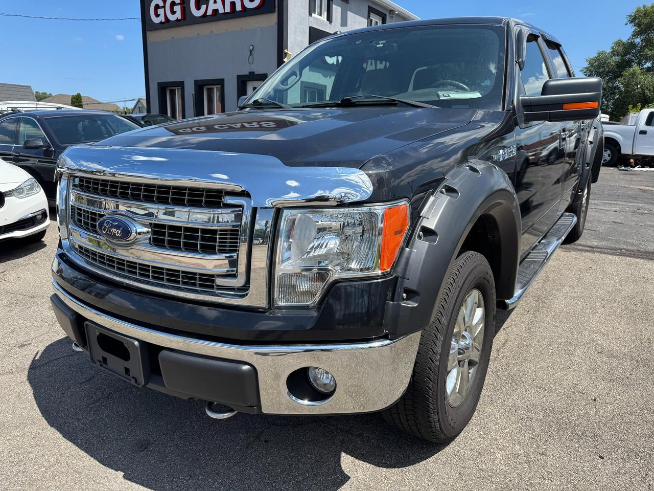 <p>✅ Certified | <strong>2014 Ford F-150 XLT | 5.0L V8 | One Owner | No Accidents</strong></p><p>This Certified 2014 Ford F-150 XLT is a dependable full-size pickup powered by the legendary <strong>5.0L V8</strong>, offering impressive towing capability, proven reliability, and a <strong>One Owner, No Accident</strong> history.</p><p>🔹 <strong>5.0L V8 Engine</strong><br>🔹 Automatic Transmission<br>🔹 <strong>XLT Trim &mdash; Well Equipped</strong><br>🔹 <strong>One Owner</strong><br>🔹 <strong>No Accidents</strong><br>🔹 <strong>Backup Camera</strong><br>🔹 Bluetooth &ndash; Hands-Free Calling & Audio Streaming<br>🔹 Cruise Control<br>🔹 Steering Wheel Audio & Cruise Controls<br>🔹 Air Conditioning<br>🔹 Power Windows, Locks & Mirrors<br>🔹 Keyless Entry<br>🔹 Chrome Front & Rear Bumpers<br>🔹 Chrome Grille<br>🔹 Alloy Wheels<br>🔹 Tow Package<br>🔹 Bed Liner<br>🔹 Split Folding Rear Seat<br>🔹 Traction Control & ABS<br>🔹 Spacious Crew Cab Interior<br>🔹 Runs and Drives Excellent</p><p>📍 Visit Us:<br>74 Parkdale Avenue North, Hamilton, Ontario</p><p>📞 Call or Text:<br>(905) 975-9705 / (905) 462-5542</p><p>📧 Email:<br><a href=mailto:gusmarkos@gmail.com>gusmarkos@gmail.com</a></p><p>🗓️ Test Drives by Appointment Only &mdash; Book Yours Today</p><p>🛡️ Buy With Confidence &mdash; OMVIC Licensed Dealership<br>✔️ CARFAX VERIFIED &mdash; Full History & Lien-Free<br>✔️ No Hidden Fees &mdash; Just Price + HST + Licensing<br>✔️ Trade-Ins Welcome &mdash; Top Dollar for Your Vehicle<br>✔️ Don&rsquo;t See What You Want? We&rsquo;ll Find It for You</p><p>💻 100% Online Purchase Available &mdash; Financing & Delivery Options<br>🚗 Ontario-Wide Delivery Available<br>✈️ Ask About Our Customer Travel Program</p>