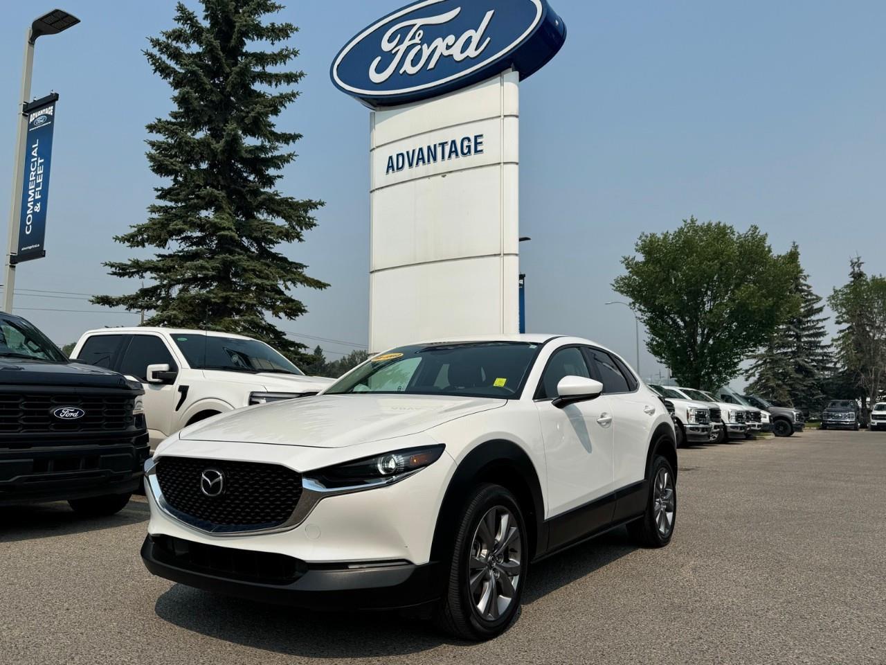 <p>Looking for a stylish and capable 2024 Mazda CX-30 GS AWD in Calgary? This well-equipped SUV offers the perfect blend of comfort, efficiency, and confidence with Mazda's intelligent all-wheel drive system, advanced safety features, and modern connectivity. Whether you're navigating city streets or heading out on a weekend getaway, this CX-30 is ready for every journey.</p><ul><li><p>All-Wheel Drive (AWD)</p></li><li><p> Heated Front Seats</p></li><li><p>Backup Camera</p></li><li><p>Bluetooth Connectivity</p></li><li><p>Smart Device Integration</p></li><li><p>Lane Assist</p></li><li><p>Cruise Control</p></li><li><p>Keyless Entry</p></li><li><p>Alloy Wheels</p></li><li><p>Brake Assist</p></li><li><p>Air Conditioning</p></li><li><p>Low Kilometers</p></li></ul><p>Powered by a 2.5L 4-cylinder engine paired with an automatic transmission, this Mazda CX-30 delivers a smooth and responsive driving experience while maintaining excellent fuel efficiency. Mazda's AWD system provides added confidence and traction in Calgary's changing road conditions.</p><p>Designed with comfort and convenience in mind, the CX-30 offers a refined driving experience for daily commutes and longer road trips.</p><p>Drive with confidence thanks to advanced safety technologies including:</p><p>Lane Assist</p><p> Backup Camera</p><p> Brake Assist</p><p> Advanced Airbag System</p><p> Electronic Stability Control</p><p> Traction Control System</p><p> Anti-Lock Braking System (ABS)</p><p>This 2024 Mazda CX-30 GS AWD for sale in Advantage Ford Calgary has been fully inspected by our certified technicians and is ready for its next owner. With only 42,146 km, this low-kilometre SUV offers exceptional value, modern features, and the reliability Mazda is known for.</p><p>Contact our team today to schedule a test drive or learn more about financing options. We proudly serve Calgary, Airdrie, Cochrane, Okotoks, Chestermere, and surrounding areas.</p>