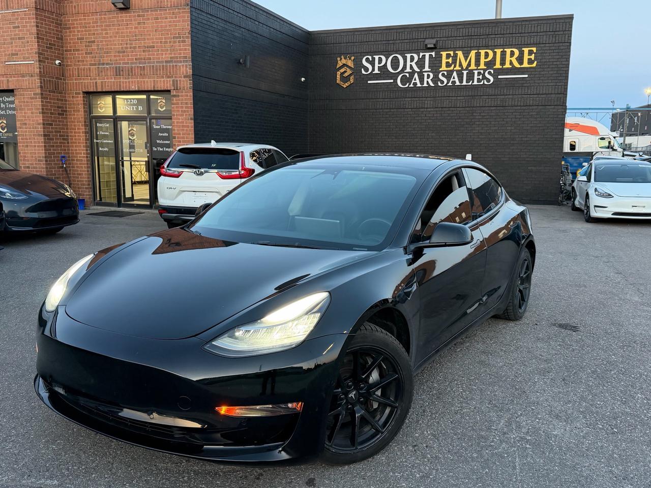 *FULLY LOADED* *RWD* *LOW KMS* *HEATED SEATS* *REVERSE CAMERA* *AUTOMATIC* and much MORE!! Safety Certificate NOT included in the price | SAFETY: $699 Year: 2022 Make: Tesla Model: 3 Trim: RWD Kms: 75,987 Finance Price: $23,880 Cash Price: $24,880 Sport Empire Cars, offering a beautiful Tesla Model 3 RWD with ONLY 75,647 kms!! For the affordable price of $23,880+HST and licensing. Beautiful White exterior with a Black leather interior. Professionally detailed and ready to go. Perfect combination of reliability, comfort and luxury. Buy with Trust with an Ontario registered dealer. Please note: The listed price is a finance-only special. If you wish to purchase the vehicle with cash, a $1,000 premium will be added to the sale price. ** In accordance with OMVIC regulations, please be advised that the vehicle being offered is not currently certified, e-tested or drivable. Certification is available for an additional fee starting from $699. With our safety package the vehicle comes with a 36 day safety standard warranty, complimentary oil change and inspection report.