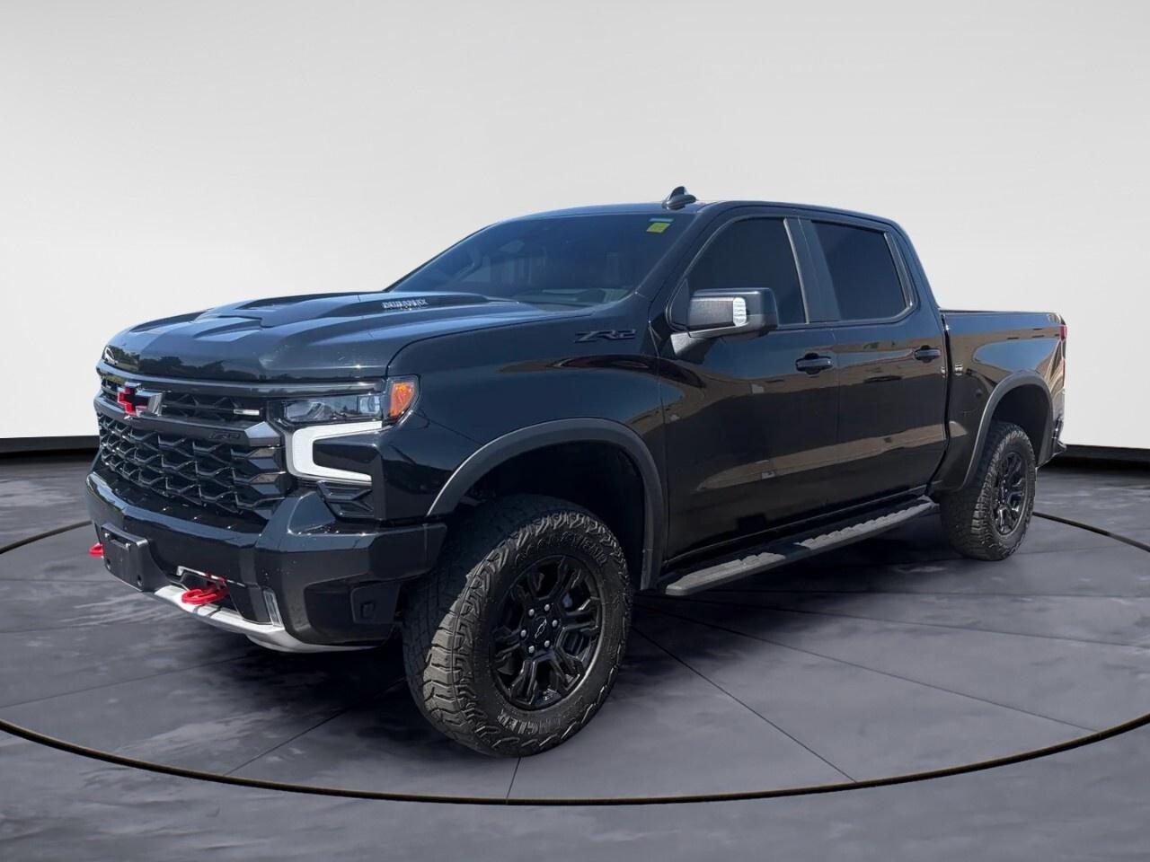 Introducing the 2024 Chevrolet Silverado 1500 ZR2 in a bold [Color] finish, featuring a robust 4&times;4 drivetrain that ensures exceptional handling and capability. This Crew Cab Short Box truck embodies strength and versatility, ready to tackle any challenge.

The exterior of the Silverado ZR2 is designed with both style and functionality in mind, boasting alloy wheels and a commanding presence. Inside, youre welcomed by luxurious leather seats that are heated and cooled, ensuring comfort in every season. With its spacious cab, this truck provides ample room for passengers and cargo alike.

Technology is at the forefront with the Silverado ZR2. Stay connected on the go with Bluetooth, a Wi-Fi hotspot, and smart device integration. Safety is prioritized through features like a backup camera, lane assist, and parking sensors. Remote start, keyless entry, and power windows complement the convenient tech-focused environment.

This truck is ideal for adventurers and professionals alike, offering powerful performance and advanced features to meet diverse needs. Visit Windsor Chrysler today to experience the Chevrolet Silverado 1500 ZR2 firsthand and learn more from our expert team!