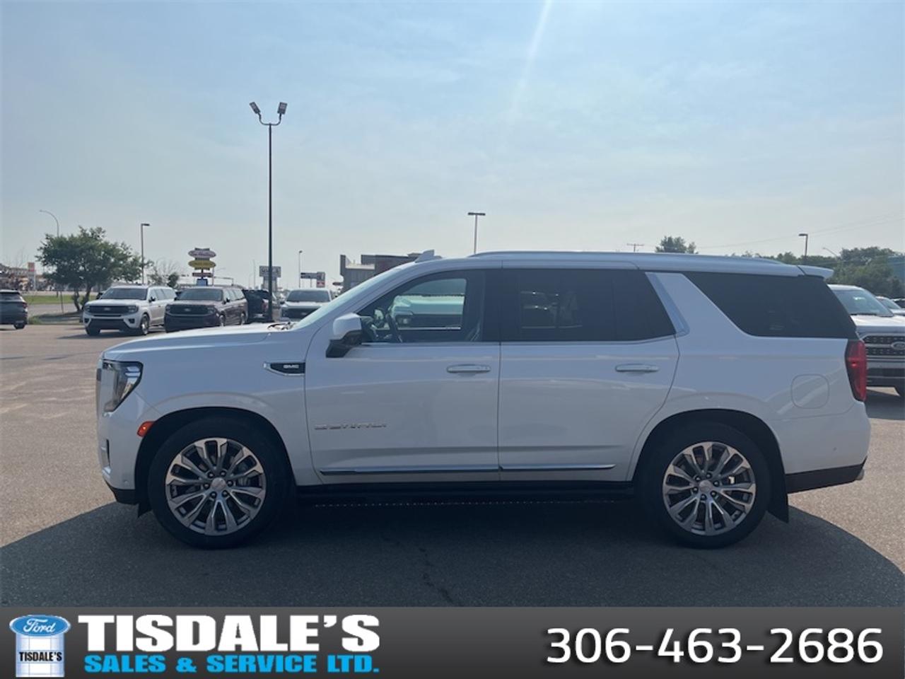 <b>Navigation,  Heads-Up Display,  Leather Seats,  Cooled Seats,  Power Liftgate!</b><br> <br> Check out the large selection of pre-owned vehicles at Tisdales today!<br> <br>Highly intuitive and built around an active family mindset, there isnt much this GMC Yukon cannot achieve. This 2023 GMC Yukon is fresh on our lot in Kindersley.<br> <br>This GMC Yukon is a traditional full-size SUV thats thoroughly modern. With its truck-based body-on-frame platform, its every bit as tough and capable as a full size pickup truck. The handsome exterior and well-appointed interior are what make this SUV a desirable family hauler. This GMC Yukon sits above the competition in tech, features and aesthetics while staying capable and comfortable enough to take the whole family and a camper along for the adventure.<br> <br>This SUV has 62,740 km. Its White in colour. It has an Automatic transmission and is powered by a 420HP 6.2L 8 Cylinder Engine. <br> <br> Our Yukons trim level is Denali. This Premium Yukon Denali comes with an ultra premium design, featuring a massive 15 inch heads up display, cooled leather seats, an impressive Magnetic Ride Control suspension, a large 10.2 inch colour touchscreen featuring navigation, wireless Apple CarPlay, Android Auto, an exclusive interior dash design, chrome exterior accents, a unique front grille and LED headlights. This distinctive SUV also includes a leather wheel, power liftgate, a Bose Surround audio system, 4G WiFi hotspot, GMC Connected Access, a remote engine start, HD Surround Vision, Teen Driver Technology, front and rear pedestrian alert, front and rear parking assist, lane keep assist with lane departure warning, tow/haul mode, automatic emergency braking, trailering equipment, wireless charging and plenty of cargo room! This vehicle has been upgraded with the following features: Navigation, Heads-Up Display, Leather Seats, Cooled Seats, Power Liftgate, Lane Keep Assist, Remote Start.<br> <br>To apply right now for financing use this link: <a href=http://www.tisdales.com/shopping-tools/apply-for-credit.html target=_blank>http://www.tisdales.com/shopping-tools/apply-for-credit.html</a><br> <br/><br>Tisdales is not your standard dealership. Sales consultants are available to discuss what vehicle would best suit the customer and their lifestyle, and if a certain vehicle isnt readily available on the lot, one will be brought in. o~o