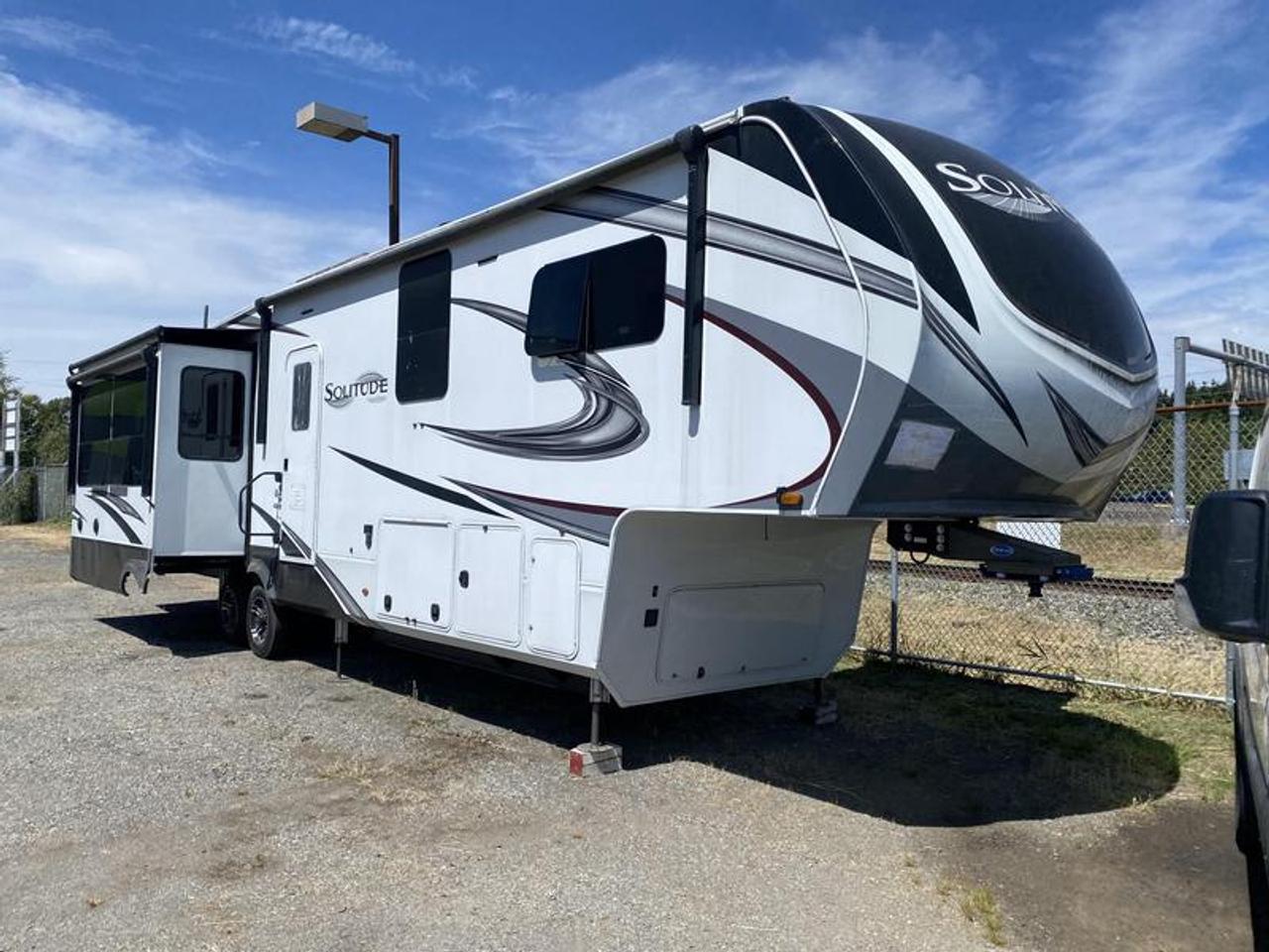 2021 Grand Design Recreational Solitude ST378MBS 40 Foot Fifth Wheel Trailer with 4 Slides Out, 2 door, air conditioning, white exterior, tan interior.
The Grand Design Solitude 378MBS (often listed as ST378MBS) is a premium, four-slide luxury fifth wheel designed for full-time and extended-season living. It features a unique mid-bunk floorplan and comfortably sleeps up to 7 people.Key SpecificationsExterior Length: 40 feet 2 inchesDry Weight: 14,344 lbsGVWR (Gross Vehicle Weight Rating): 16,800 to 18,000 lbs (varies by model year)Hitch Weight: 2,686 lbsFresh Water Capacity: 81 to 93 gallonsGray Water Capacity: 100 to 106 gallonsBlack Water Capacity: 50 to 53 gallonsNotable FeaturesFloorplan Layout: Features a mid-bunk room that can be used as an office or a second bedroom, a loft above the bunk area, and a spacious rear living space.Four-Season Capable: Built with Weather-Tek Arctic Insulation and heated, enclosed underbelly holding tanks.Exterior: Includes a drop-frame for massive passthrough storage, a receiver hitch, and a 6-point hydraulic auto-leveling system.Interior: Hardwood cabinetry, a large pantry, a kitchen island, and a front master suite with a walk-around bed and large wardrobe.  $47,510.00 plus $375 processing fee, $47,885.00 total payment obligation before taxes.   Listing report, warranty, contract commitment cancellation fee, financing available on approved credit (some limitations and exceptions may apply). All above specifications and information is considered to be accurate but is not guaranteed and no opinion or advice is given as to whether this item should be purchased. We do not allow test drives due to theft, fraud, acts of vandalism and undetectable impaired driving. Instead we provide the following benefits: Complimentary Warranty (with options to extend), Limited Money Back Satisfaction Guarantee on Fully Completed Contracts, Contract Commitment Cancellation, and an Open-Ended Sell-Back Option. Ask seller for details or call 604-522-REPO(7376) to confirm listing availability.