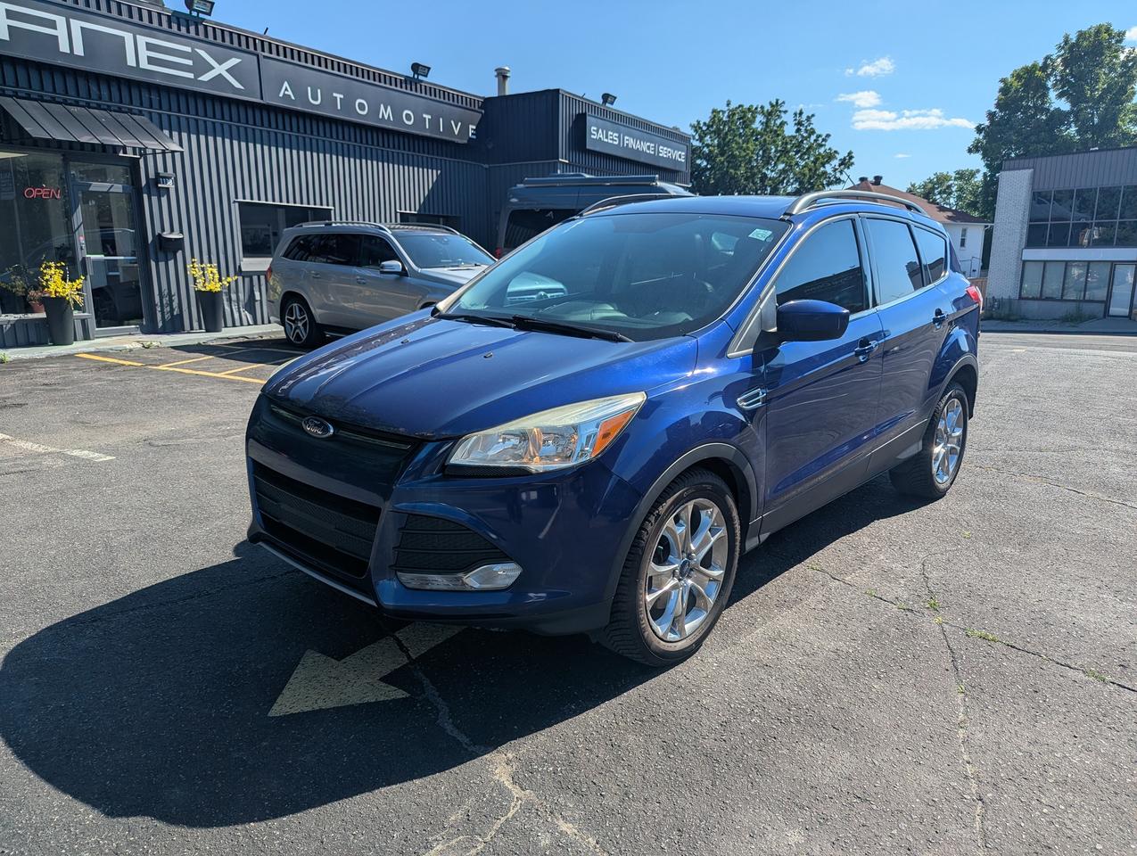 <p>Get ready to explore your next adventure in this stylish and capable 2015 Ford Escape SE, now available at Janex Auto Sales! Dressed in a vibrant blue exterior and featuring a sleek black interior, this SUV/Crossover is designed to turn heads while offering exceptional versatility for your daily commutes and weekend getaways. With its comfortable 5-door design and robust 4-wheel drive system, youll experience confidence and control on any road, in any Canadian weather.</p><p>This 2015 Ford Escape SE is more than just a good-looking vehicle; its packed with features to enhance your driving experience. Boasting 149,211 kilometers, this well-maintained Escape is ready to serve you reliably. Whether youre navigating city streets or venturing off the beaten path, the automatic transmission ensures a smooth and responsive ride, making every journey a pleasure.</p><p>Here are 5 features that make this 2015 Ford Escape SE truly stand out:</p><ul><li><strong>Go Anywhere 4-Wheel Drive:</strong> Conquer any road condition with confidence, from icy winter mornings to gravel cottage roads, this system provides superior traction and stability.</li><li><strong>Spacious SUV/Crossover Versatility:</strong> Whether youre hauling groceries, sports equipment, or weekend adventure gear, the ample cargo space and flexible seating configuration have you covered.</li><li><strong>Eye-Catching Blue Exterior:</strong> Make a statement with this vibrant blue finish that&rsquo;s sure to stand out in any parking lot and impress on the road.</li><li><strong>Comfortable Black Interior:</strong> Enjoy a sophisticated and durable interior that&rsquo;s easy to maintain and complements the exteriors stylish aesthetic.</li><li><strong>Smooth Automatic Transmission:</strong> Experience effortless driving with the responsive automatic transmission, designed for a comfortable and convenient ride every time you get behind the wheel.</li></ul><p><strong><em>Powered by AutoIntelligence&trade;</em></strong></p><p>Vehicle information has been generated using artificial intelligence and is provided for informational purposes only. While efforts are made to ensure accuracy, please confirm all details directly with the dealer.</p>