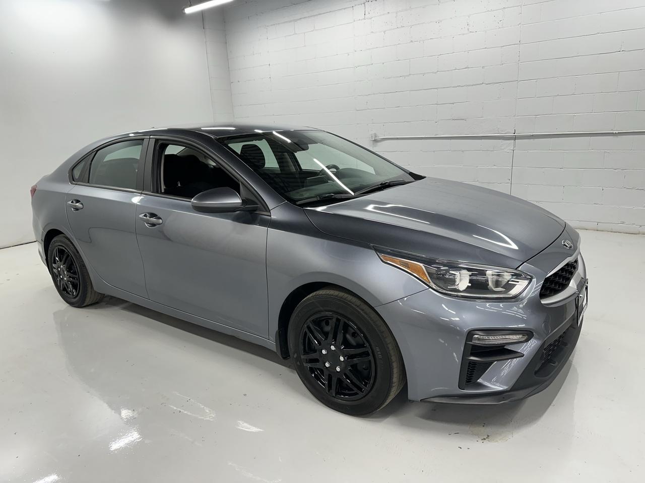 <p>Looking for a reliable and stylish sedan that wont break the bank? Troys Toys has just the vehicle for you: a pre-loved 2020 Kia Forte LX IVT. This sleek grey sedan is ready to hit the road, offering a comfortable and efficient driving experience for your daily commute or weekend adventures. With its classic four-door design and a spacious black interior, it&rsquo;s the perfect blend of practicality and modern appeal.</p><p>Under the hood, youll find a fuel-efficient 2.0L I4 engine paired with a smooth Variable/CVT transmission, delivering a responsive and enjoyable drive. The front-wheel-drive configuration ensures confident handling in various Canadian conditions. This 2020 Kia Forte LX IVT has been well-maintained and has 165,421 kilometers on the odometer, meaning its ready for many more miles of reliable service.</p><p>At Troys Toys, were confident youll love what this Kia Forte has to offer. Its a smart choice for anyone seeking a dependable and feature-packed compact sedan.</p><p>Here are 5 features that make this 2020 Kia Forte LX IVT a fantastic find:</p><ul><li><strong>Smooth and Efficient CVT Transmission:</strong> Experience a seamless and fuel-sipping drive thanks to the advanced Continuously Variable Transmission, making every journey more relaxed and economical.</li><li><strong>Comfortable Black Interior:</strong> Step into a clean and inviting cabin designed for your comfort, with a sleek black interior that&rsquo;s both stylish and practical.</li><li><strong>Dependable 2.0L I4 Engine:</strong> Enjoy a perfect balance of performance and efficiency with the proven 2.0-litre four-cylinder engine, ready to tackle your daily driving needs.</li><li><strong>Sleek Sedan Design:</strong> Turn heads with the modern and sophisticated lines of this grey four-door sedan, a timeless look that never goes out of style.</li><li><strong>Front-Wheel Drive Confidence:</strong> Benefit from predictable handling and a secure feel on the road, providing you with peace of mind wherever you roam.</li></ul><p><strong><em>Powered by AutoIntelligence&trade;</em></strong></p><p>Vehicle information has been generated using artificial intelligence and is provided for informational purposes only. While efforts are made to ensure accuracy, please confirm all details directly with the dealer.</p>