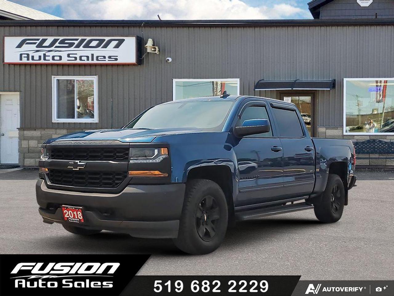 <p>5.3LV8, 4X4, Full Crew Cab, Hard Top Tri Fold Tonneau Cover, Tow Pkg, Custom Exhaust, Remote Start, Back Up Camera, Side Step Bars, Window Louvers, Bluetooth, and more. Lic & HST Extra.</p><p>Looking for a rugged and reliable truck that can handle anything you throw at it? Come down to Fusion Auto Sales and check out this stunning blue 2018 Chevrolet Silverado 1500 4WD Crew Cab LT. With its powerful 5.3L V8 engine and 4-wheel drive capability, this Silverado is built to conquer any road, from city streets to rugged backroads, and it&rsquo;s ready for adventure with 159,847 kilometers on the odometer. The spacious black interior offers comfortable seating for the whole crew, making it perfect for work or weekend getaways.</p><p>This Silverado 1500 LT is more than just a workhorse; its a capable and comfortable companion. Whether youre hauling equipment for a job, towing a trailer for a weekend project, or simply cruising through the Canadian landscape, this truck delivers the performance and versatility you need. The Crew Cab design ensures ample space for passengers in the rear, and the 143.5 bed provides plenty of room for all your gear.</p><p>Here are five of the standout features of this 2018 Chevrolet Silverado 1500 LT:</p><ul><li><strong>Powerful 5.3L V8 Engine:</strong> Experience exhilarating performance and confident towing power with this legendary V8.</li><li><strong>Rugged 4-Wheel Drive:</strong> Tackle any weather condition or off-road terrain with superior traction and control.</li><li><strong>Spacious Crew Cab:</strong> Comfortably seat up to six passengers in the roomy and well-appointed interior.</li><li><strong>Generous 143.5 Bed:</strong> Haul lumber, equipment, or your outdoor gear with ease.</li><li><strong>Sleek Blue Exterior:</strong> Turn heads with this eye-catching and classic truck colour.</li></ul><p><strong><em>Powered by AutoIntelligence&trade;</em></strong></p><p>Vehicle information has been generated using artificial intelligence and is provided for informational purposes only. While efforts are made to ensure accuracy, please confirm all details directly with the dealer.</p><p>The Fusion Philosophy<br><br>At Fusion Auto Sales, we put more effort into buying our vehicles than we do trying to sell them. By constantly monitoring what other car lots are doing, we strive to be the lowest priced dealer in our market. We won&rsquo;t purchase a vehicle to &ldquo;fill a hole&rdquo;. We know that the vehicles on our lot are great value for the money and smart shoppers realize that also. Adhering to this philosophy makes it easy for our customers. If they find a vehicle on our lot that fulfills their needs and wants, they know that they&rsquo;re getting great value. <br><br>If we don&rsquo;t have what you&rsquo;re looking for, we can find it! Over 150 customers have saved thousands of dollars buy joining our&rdquo; locate club&rdquo;. People that know what they want and what they want to pay (within reason of course), get the vehicle of their dreams and enjoy huge savings. Contact us for details.<br><br><br><br>Fusion Auto Sales is in Tilbury, Ont. located between Windsor and London right off the 401. We are among 7 dealerships within a &frac12; kilometer distance which is great for out of town shoppers. We began satisfying customers in 2009 and have been doing so ever since. In 2012 Fusion was recognized as 1 of the 50 fastest growing companies in Canada. And then, in 2018, we were named one of the top 5 independent automobile dealerships in the country. <br><br>We specialize in late model vehicles at below than average pricing, everything is fully certified and every unit is Car Proof verified and is fully disclosed with every unit. We offer every type of financing from perfect credit at great rates to credit challenges with competitive rates. We also specialize in locating vehicles for customers, we cant have everything on the lot so if you do not see it and are having a hard time finding what you are looking for, let us know and we can find it for you. Fusion Auto Sales spans its customer base from Windsor all the way to Timmins, On and every where in between. Our philosophy is You are going to like the way we deal and everyone does, straight honest answers with no monkey business and no back and forth between sales and managers.</p>