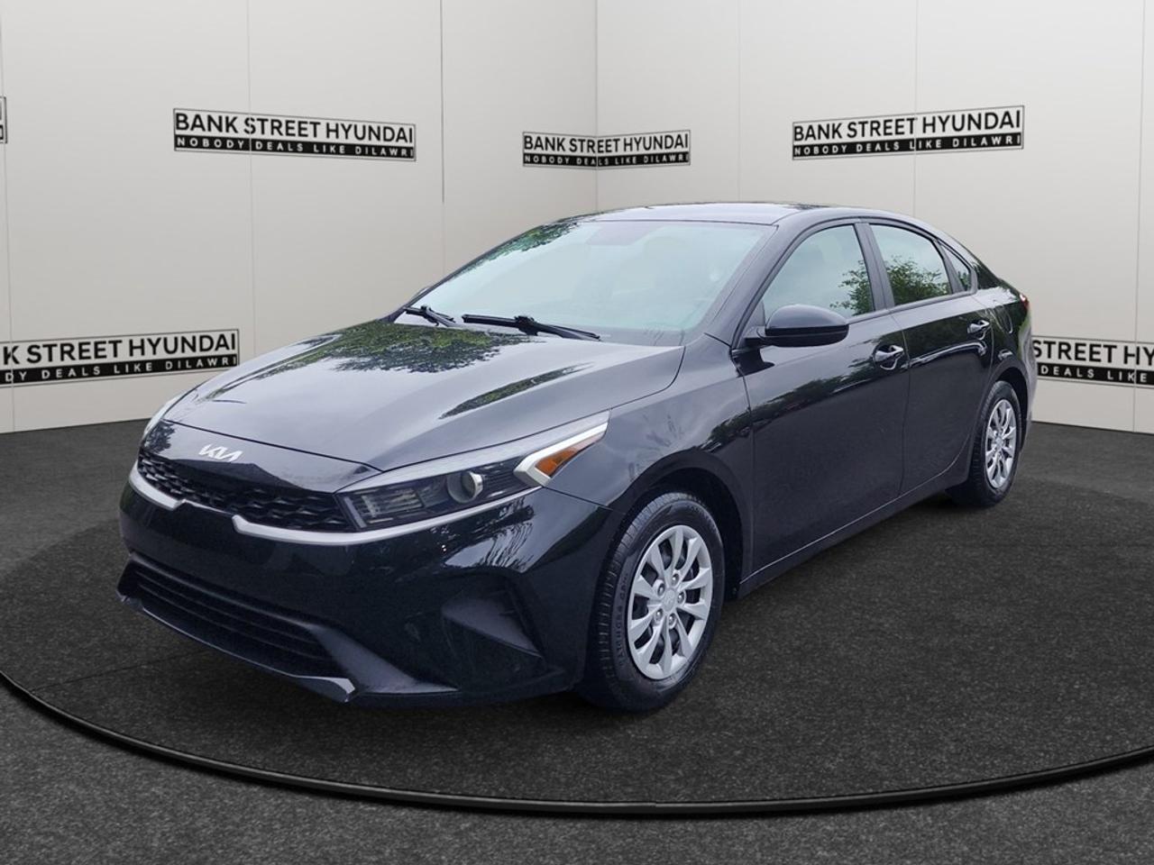 Presenting the 2022 Kia Forte LX, a stunning blue sedan equipped with a smooth automatic transmission and efficient front-wheel drive. Whether youre navigating city streets or cruising on the open road, the Forte LX offers exceptional handling and performance. The unmistakable all-blue exterior of this sedan beautifully complements its sleek design, ensuring you make a statement wherever you go. Inside, experience comfort like never before with high-quality materials and spacious seating, enhanced by features including air conditioning, heated seats, and power windows for a refined driving environment. Access your vehicle effortlessly with keyless entry and maintain control with ease through features like cruise control and brake assist. Stay connected and entertained on every journey with smart device integration and a reliable Bluetooth connection. The modern tech setup is not only convenient but also keeps safety at the forefront, featuring a backup camera for added peace of mind while maneuvering in tight spaces. If youre a driver seeking a stylish, practical vehicle that provides comfort, safety, and connectivity, the 2022 Kia Forte LX could be your perfect match. Reach out to Bank Street Hyundai today for more information and to arrange a viewing of this exceptional sedan.