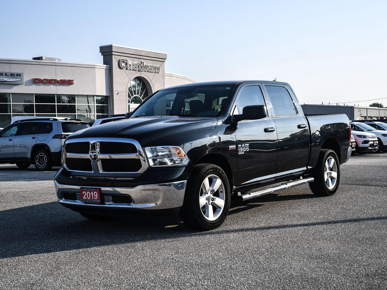 Legendary HEMI power. Proven local history. Built to work.<br /><br />The 2019 Ram 1500 Classic SLT delivers everything Canadians have come to expect from a Ram truck, legendary HEMI performance, everyday comfort, and dependable capability. As a local trade, this truck has remained close to home and comes with the kind of history buyers appreciate. With 130,259 kilometres, it's ready to provide many more years of dependable service, combining rugged capability with thoughtful features and timeless styling.<br /><br />Finished in Brilliant Black Crystal Pearlcoat, this Crew Cab commands attention with its bold front grille, muscular body lines, 20-inch aluminum wheels, heated exterior mirrors, and unmistakable Ram presence. The spacious four-door configuration provides easy access for passengers while offering the versatility that has made the Ram 1500 Classic one of Canada's favourite full-size pickups.<br /><br />Inside, the SLT trim strikes an ideal balance between durability and comfort. Premium cloth bucket seats, a power 10-way driver's seat with lumbar adjustment, dual-zone automatic climate control, a full-length upgraded floor console, a flat-load rear floor, and a 60/40 split-folding rear seat create a cabin that's equally suited for long highway drives and busy workdays.<br /><br />Technology is front and centre with the intuitive 8.4-inch Uconnect® 4C NAV touchscreen featuring built-in navigation, Apple CarPlay®, Android Auto, Bluetooth® hands-free connectivity, HD Radio, SiriusXM® Satellite Radio with Traffic and Travel Link, multiple USB charging ports, and an easy-to-use interface that keeps you connected wherever the road takes you.<br /><br />Under the hood is the legendary 5.7L HEMI® V8 paired with a smooth-shifting 8-speed automatic transmission and dependable four-wheel drive, delivering the power and confidence needed for towing, hauling, or tackling challenging road conditions. Electronic Stability Control, Brake Assist, a ParkView® Rear Back-Up Camera, four-wheel disc brakes, Active Grille Shutters, and a block heater provide added confidence through every Canadian season.<br /><br />Whether you're towing the trailer, heading to the job site, or loading up for a weekend at the cottage, the Ram 1500 Classic SLT delivers the capability, comfort, and unmistakable V8 character that continues to make Ram trucks a favourite among Canadian drivers.<br /><br />Some trucks are built to work. This Ram was built to do it with HEMI power and confidence.<br /><br />Here at Chatham Chrysler, our Financial Services Department is dedicated to offering the service that you deserve. We are experienced with all levels of credit and are looking forward to sitting down with you. Chatham Chrysler Proudly serves customers from London, Ridgetown, Thamesville, Wallaceburg, Chatham, Tilbury, Essex, LaSalle, Amherstburg and Windsor with no distance being ever too far! At Chatham Chrysler, WE CAN DO IT!