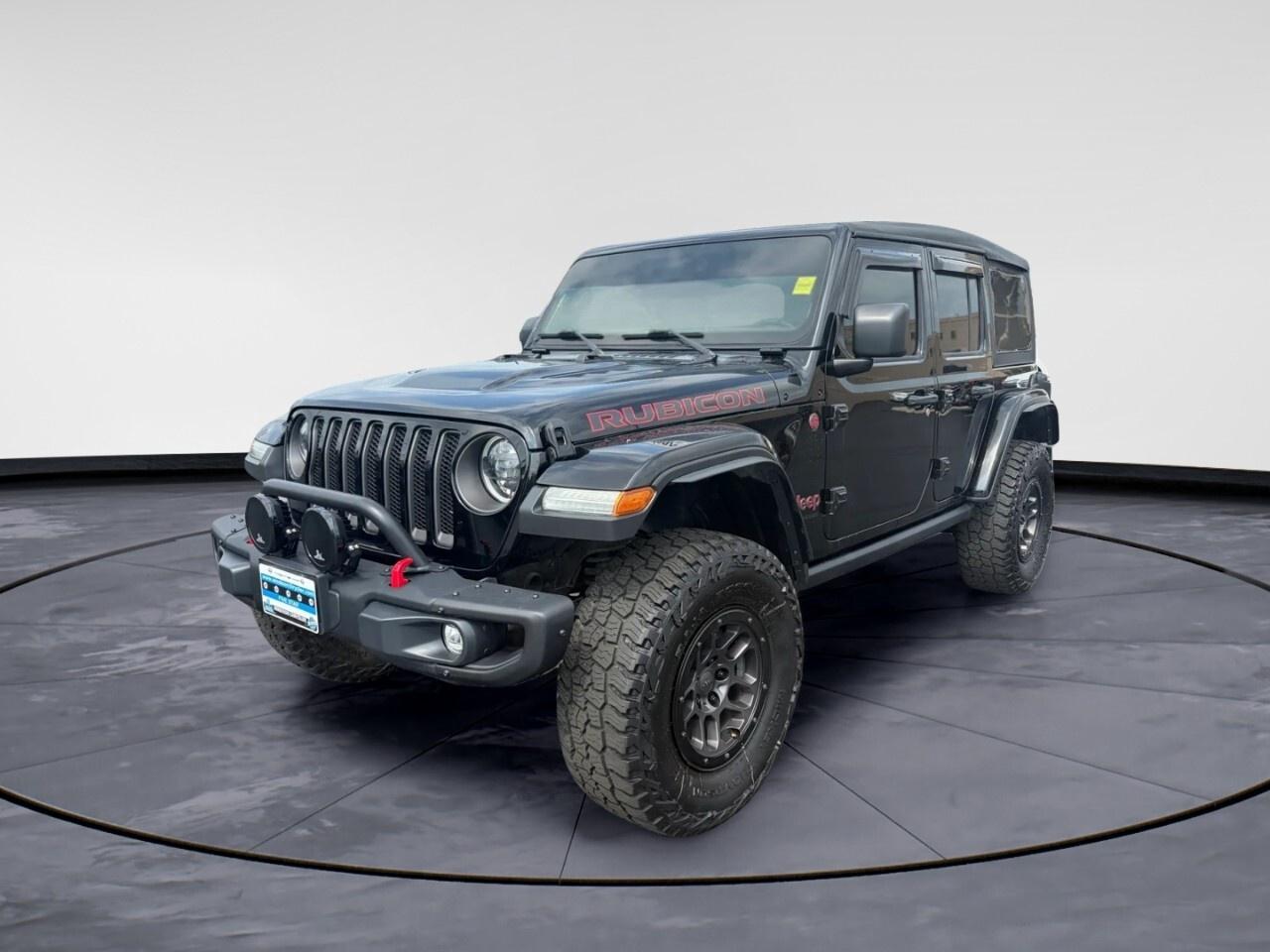 Step into adventure with the 2023 Jeep Wrangler Rubicon, a striking SUV adorned in a captivating package with unmatched 4&times;4 capabilities. Built to handle both rugged terrains and urban landscapes, this Wrangler offers the iconic off-road prowess combined with the convenience of an automatic transmission.

The robust exterior featuring alloy wheels is designed to turn heads wherever you go. Inside, youll find a mix of functionality and comfort with air conditioning, power windows, and a leatherette steering wheel. Convenience is elevated with features like keyless entry and a spacious interior designed for all types of adventures.

Stay connected and safe on the road thanks to cutting-edge technology. A large touchscreen hosts the navigation system, providing you with the guidance you need on every journey. Bluetooth connection and smart device integration keep your devices linked effortlessly, while a wi-fi hotspot ensures youre always online. Safety features like brake assist, a backup camera, and heated mirrors enhance your driving confidence, whether conquering the trail or navigating the city.

This Jeep Wrangler Rubicon is perfect for thrill-seekers and weekend warriors who demand performance and versatility. Ready to elevate your driving experience? Contact Windsor Chrysler to learn more and get behind the wheel of this incredible vehicle.