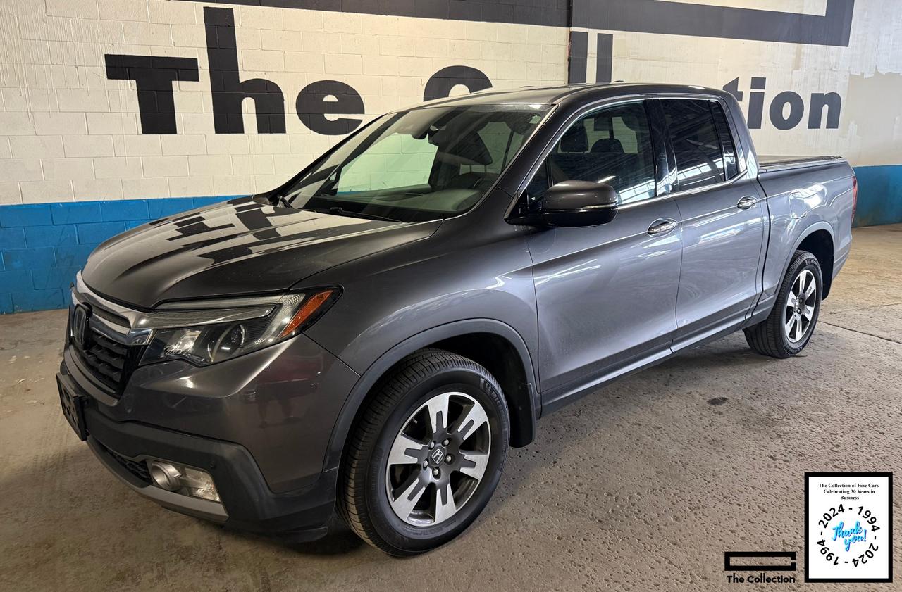 This stunning local Honda Ridgeline Touring has just arrived with a clean vehicle history and is ready to go. A verified Carfax vehicle search is included. Showroom condition both inside and out this Honda Ridgeline wont be around for long. Hurry in before its gone. <BR><BR>The Collection of Fine Cars Inc. has performed an in depth analysis and inspection to ensure the quality of the vehicle so you can be confident in your purchase. *Certification - All vehicles can be certified for an additional cost of $999.00 and are professionally detailed so when you drive away you will be proud of your new purchase and the envy of your neighbours and friends. If not certified, then per OMVIC regulations the vehicle is not drivable and not certified. Taxes and licensing fees are additional. <BR><BR>Our Team of Financing Specialists can help get into the car of your dreams no matter your credit situation. Deferred Financing solutions are available so you dont have to pay for up to 90 Days. We are here to help people get the financing they need along with the vehicle they want. With our experienced in house finance specialists we can help anyone obtain the loan needed for that new or used car, truck, or SUV. Whether you have Perfect Credit, Bad Credit, Slow, Bankruptcy, Divorce, Self-Employed, New to the Country, at The Collection we can help. With as little as 0 Down you can get into the car of your dreams at The Collection of Fine Cars. <BR><BR>This Honda Ridgeline Touring comes finished in a shimmering Modern Steel Met on Graphite Leather  Interior and includes an abundance of premium and sport appointments including a Automatic Transmission, Power Roof, AWD, Keyless Entry with push-button start, Heated Seats,  Factory Honda Navigation with Smartphone Integration with Apple Car Play, Back-Up Camera with Park Assist, Tonneau Cover and so much more.<BR><BR>The Collection of Fine Cars Inc has been serving the community for 30 years. For over 3 decades Richard and Tim have be combing the province and sometimes the country to find the best possible vehicles to offer our clients. Come and see our 25000 sq ft indoor showroom for yourself. Whether its sunny or snowy the elements wont be a problem come indoors and rarely does our inventory of premium automobiles drop below 100. We invite you to experience The Collection today. *Celebrating 30 Years in Business 1994-2024. <BR><BR>* Even though we take reasonable precautions to ensure that the information provided is accurate and up to date, we are not responsible for any errors or omissions. Please verify all information directly with The Collection of Fine Cars Inc to ensure its accuracy. <BR><BR>
