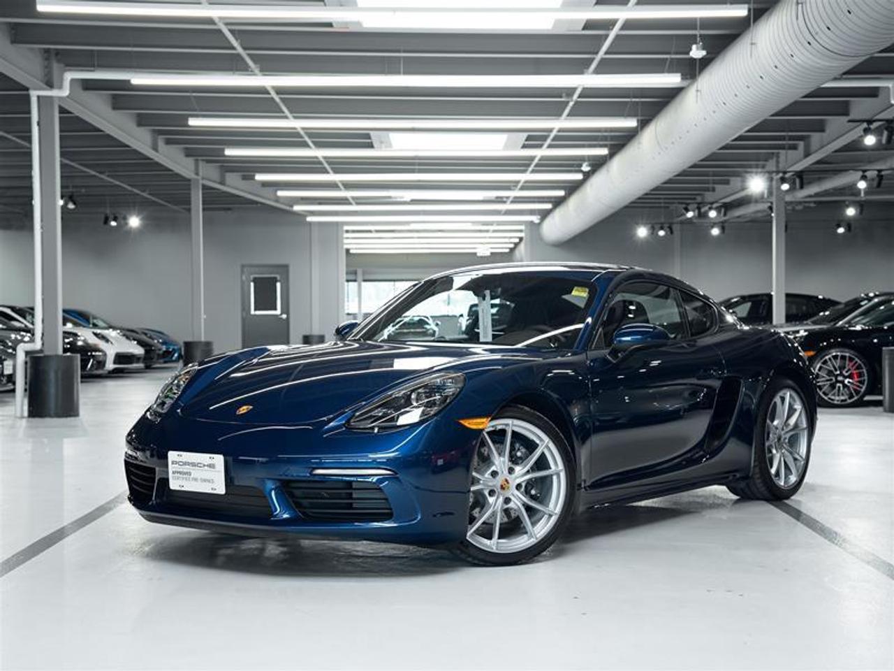 ***Leasing Options Available on Certified Pre-Owned Porsches*** The Porsche that you’ve always wanted. This 2025 718 Cayman has a Clean CarFax Report. With Standard Interior in Black i.c.w. Leather Sport Seats Plus, Gentian Blue Metallic ($740), Premium Package ($2,870), Exclusive Design Fuel Cap ($190), Sport Chrono Package ($2,980), Sport Tailpipes in Silver ($750), Extended Range Fuel Tank, 16.9 gal ($160), Wheel Center Caps with Colored Porsche Crest ($220), Locking Wheel Bolts ($70), 20 Carrera S Wheels ($3,110), Sport Seats Plus (2-way) ($920), GT Sport Steering Wheel in Leather ($370), Porsche Crest on Headrests ($330), Interior Trim Painted in Exterior Color i.c.w. Standard Interior ($850), BOSE® Surround Sound System ($1,130), LED Headlights incl. Porsche Dynamic Light System (PDLS) ($750), and Smoking Package, this is the car for you! Look for the Porsche Approved seal when buying a pre-owned Porsche. Porsche Approved Pre-Owned Cars are inspected in compliance with our 111-point checklist and any work required is performed using only 100% Porsche Genuine Parts. As proof of the trust that we have in the quality of our vehicles, every certified pre-owned car comes with a minimum of 24 months Porsche Approved Warranty and Porsche Roadside Assistance. The Porsche Approved Warranty covers all components of your Porsche and offers the same level of security as our new car warranty. Luxury Tax is not charged on Certified Pre-Owned vehicles. Call us at 613-749-4275 and ask to speak to one our Porsche Brand Executives. Serving the Ottawa & Gatineau region. *** Options de location disponibles pour les Porsche doccasion certifiées *** La Porsche de vos rêves. Cette voiture 2025 718 Cayman a un bon rapport d’historique de véhicule de CarFax. Grâce à Standard Interior in Black i.c.w. Leather Sport Seats Plus, Gentian Blue Metallic ($740), Premium Package ($2,870), Exclusive Design Fuel Cap ($190), Sport Chrono Package ($2,980), Sport Tailpipes in Silver ($750), Extended Range Fuel Tank, 16.9 gal ($160), Wheel Center Caps with Colored Porsche Crest ($220), Locking Wheel Bolts ($70), 20 Carrera S Wheels ($3,110), Sport Seats Plus (2-way) ($920), GT Sport Steering Wheel in Leather ($370), Porsche Crest on Headrests ($330), Interior Trim Painted in Exterior Color i.c.w. Standard Interior ($850), BOSE® Surround Sound System ($1,130), LED Headlights incl. Porsche Dynamic Light System (PDLS) ($750), and Smoking Package, cette voiture est parfaite pour vous! Trouvez le sceau d’approbation de Porsche lorsque vous achetez une Porsche d’occasion. Les voitures d’occasion approuvées par Porsche sont inspectées conformément à notre liste de vérification de 111 points. Tout travail requis est effectué en utilisant uniquement des pièces d’origine Porsche. Comme preuve de la confiance que nous avons dans la qualité de nos véhicules, chaque voiture d’occasion certifiée fait l’objet d’une garantie d’au moins 24 mois approuvée par Porsche et de l’assistance routière Porsche. La garantie approuvée par Porsche couvre tous les composants de votre Porsche et offre le même niveau de sécurité que notre garantie pour les véhicules neufs. La taxe de luxe n’est pas appliquée aux véhicules d’occasion certifiés. Appelez-nous au 613-749-4275 pour parler à l’un de nos directeurs de marque Porsche. Au service de la région d’Ottawa et du Gatineau.