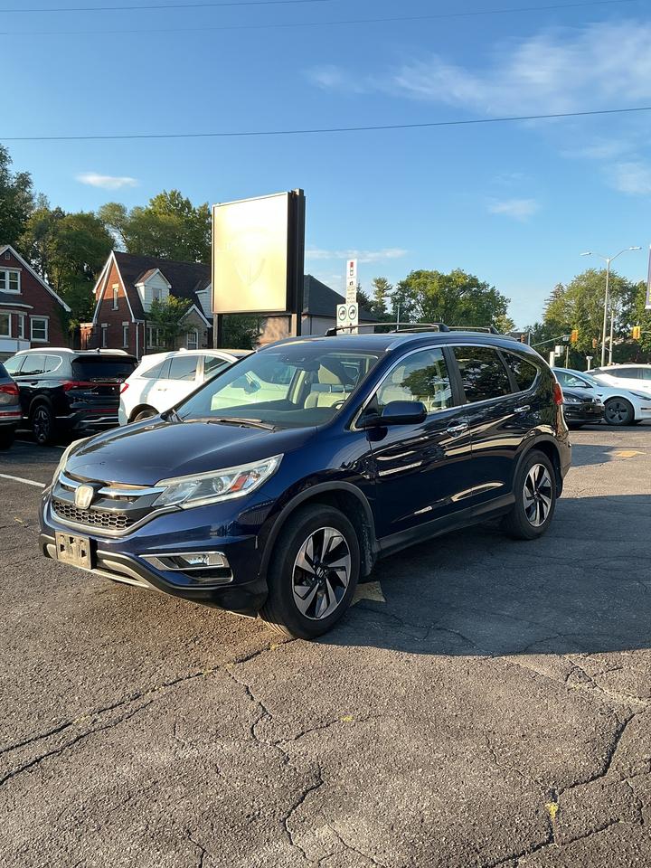 <p>Discover the perfect blend of practicality and premium comfort with this stunning blue 2015 Honda CR-V Touring, now available at Janex Auto Sales. This versatile SUV is designed for adventure and everyday life, offering ample space for passengers and cargo, all wrapped in a sleek and stylish package. The all-wheel-drive system provides confident handling in any Canadian weather condition, while the smooth Continuously Variable Transmission (CVT) ensures an efficient and enjoyable ride. Step inside and experience a refined interior that prioritizes your comfort and convenience, making every journey a pleasure.</p><p>With 168,000 kilometers, this Honda CR-V Touring has been well-maintained and is ready for many more miles of reliable service. Its the ideal choice for families, outdoor enthusiasts, or anyone seeking a dependable and feature-rich vehicle that doesnt compromise on style or capability. Come down to Janex Auto Sales and see for yourself why the CR-V remains a top contender in its class.</p><p>Here are five sizzling features that make this 2015 Honda CR-V Touring truly stand out:</p><ul><li><strong>Leather-Trimmed Seats:</strong> Sink into luxurious comfort with the premium leather-trimmed interior, adding a touch of sophistication to every drive.</li><li><strong>Power Moonroof:</strong> Let in the sunshine or enjoy a starry night with the convenient power moonroof, creating an open and airy cabin atmosphere.</li><li><strong>Navigation System:</strong> Never lose your way again with the integrated navigation system, guiding you effortlessly to your destinations.</li><li><strong>Heated Front Seats:</strong> Conquer those chilly Canadian mornings with the cozy warmth of heated front seats, ensuring a comfortable start to your day.</li><li><strong>Smart Entry and Push Button Start:</strong> Experience modern convenience with the smart entry system, allowing you to unlock the doors and start the engine with just the push of a button.</li></ul><p><strong><em>Powered by AutoIntelligence&trade;</em></strong></p><p>Vehicle information has been generated using artificial intelligence and is provided for informational purposes only. While efforts are made to ensure accuracy, please confirm all details directly with the dealer.</p>
