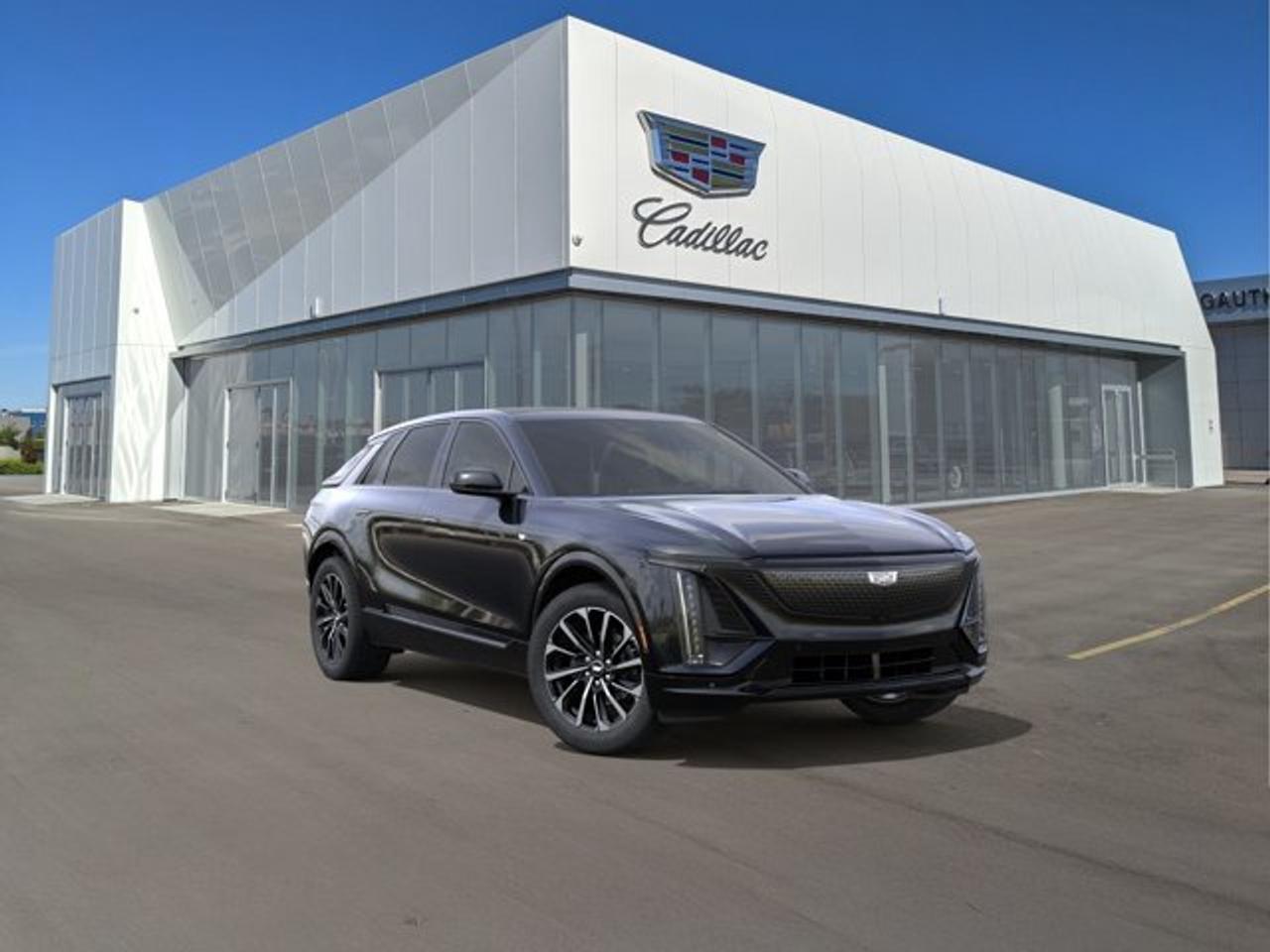 The Cadillac LYRIQ Premium Sport is a luxury all-electric SUV that combines bold styling, strong performance, and advanced technology. It features an all-wheel-drive powertrain and an impressive 525 km driving range for everyday travel and longer trips. Inside, the Premium Sport offers a sophisticated cabin with premium materials, heated and ventilated front seats with massage functionality, and a panoramic glass roof. Technology highlights include a large 33-inch curved LED display, Google built-in compatibility, an available 19-speaker AKG Studio Sound System with Dolby Atmos, and Cadillac Super Cruise hands-free driver assistance. Distinctive Sport design elements, advanced charging capability, and a comprehensive suite of safety and driver-assistance features make the LYRIQ Premium Sport a compelling blend of luxury and electric performance.