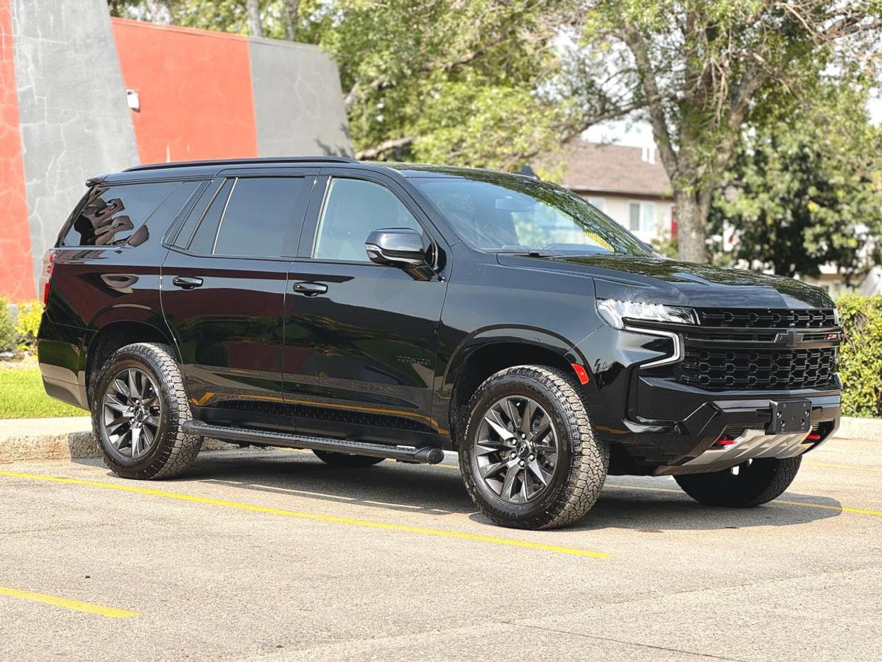 NO ACCIDENTS | 2021 Chevrolet Tahoe Z71 4WD - Leather | Off-Road Package | Full-Size SUV For Sale in Saskatoon, SK

VIN: 1GNSKPKD1MR405045
Mileage: 115,625 KM
Exterior Color: Black
Interior: Premium Black Leather
Trim: Z71 4WD
Condition: No Accidents | Full-Size SUV | Excellent Condition

2021 Chevrolet Tahoe Z71 4WD for Sale in Saskatoon, Saskatchewan

Looking for a 2021 Chevrolet Tahoe Z71 for sale in Saskatoon? This rugged yet luxurious 2021 Chevrolet Tahoe Z71 4WD is built to tackle everything from Saskatchewan winters to family road trips and off-road adventures. Finished in sleek Black with a Premium Black Leather Interior, this Tahoe combines bold styling, legendary capability, modern technology, and premium comfort.

This No Accident Tahoe Z71 is powered by Chevrolets proven 5.3L EcoTec3 V8 engine paired with a smooth 10-speed automatic transmission, delivering excellent towing capability, refined highway manners, and dependable performance in every season.

Now available at Platinum Auto Sport in Saskatoon, this Tahoe Z71 is the perfect SUV for growing families, outdoor enthusiasts, and anyone looking for a premium full-size SUV with exceptional versatility.

Powerful EcoTec3 V8 Performance

Under the hood is GMs legendary 5.3L EcoTec3 V8, delivering impressive performance, towing capability, and proven reliability.

Performance Features
5.3L EcoTec3 V8 Engine
355 Horsepower
383 lb-ft of Torque
10-Speed Automatic Transmission
Autotrac® Two-Speed Transfer Case
Four-Wheel Drive (4WD)
Automatic Locking Rear Differential
Hill Descent Control
Hill Start Assist
Heavy-Duty Suspension
Skid Plates
Red Front Recovery Hooks
Tow/Haul Mode
Trailer Sway Control
Integrated Trailer Brake Controller (if equipped)
Up to Approximately 8,200 lbs Towing Capacity (when properly equipped)
Z71 Off-Road Package

The Z71 trim is designed for customers who want extra capability without sacrificing luxury.

Z71 Features
Z71 Off-Road Suspension
Off-Road Tuned Dampers
Front Skid Plate
Red Tow Hooks
Black Exterior Accents
Unique Z71 Front Fascia
High Approach Angle Front Bumper
All-Terrain Tires
20-Inch Black Aluminum Wheels
Roof Rails
Hands-Free Power Liftgate
Premium Interior & Comfort

Inside, the Tahoe offers exceptional comfort for the whole family.

Interior Features
Premium Black Leather Seating
Heated Front Seats
Power Driver Seat with Memory
Power Front Passenger Seat
Heated Steering Wheel
Tri-Zone Automatic Climate Control
Second & Third Row Seating
Power Folding Second & Third Row (if equipped)
Spacious Seating for Up to Seven or Eight Passengers
Large Cargo Area
Premium Soft Touch Materials
Remote Start
Push Button Start
Wireless Phone Charging
Technology & Infotainment

Stay connected wherever your journey takes you.

Technology Features
Chevrolet Infotainment 3 Premium System
10.2-Inch HD Colour Touchscreen
Wireless Apple CarPlay®
Wireless Android Auto
Google Built-In Compatibility
Bluetooth® Hands-Free Calling
Bluetooth® Audio Streaming
Premium Bose® Audio System
Built-In Navigation (if equipped)
SiriusXM® Satellite Radio
USB & USB-C Charging Ports
Wi-Fi Hotspot Capability
Digital Driver Information Centre
HD Rear Vision Camera
Voice Recognition
Chevrolet Safety & Driver Assistance

The Tahoe is packed with advanced safety technology for added confidence on every drive.

Safety Features
Forward Collision Alert
Automatic Emergency Braking
Front Pedestrian Braking
Lane Keep Assist with Lane Departure Warning
Following Distance Indicator
IntelliBeam® Automatic High Beams
Rear Park Assist
HD Rear Vision Camera
Rear Cross Traffic Alert (if equipped)
Blind Zone Alert (if equipped)
Electronic Stability Control
Teen Driver Technology
Tire Pressure Monitoring System
Multiple Airbags
Exterior Features

The Tahoe Z71 stands out with bold styling and premium finishes.

Exterior Highlights
Black Exterior Finish
Exclusive Z71 Front Fascia
Black Grille
LED Headlights
LED Daytime Running Lights
LED Fog Lamps
LED Tail Lamps
Power Folding Heated Mirrors
Hands-Free Power Liftgate
20-Inch Black Aluminum Wheels
Roof Rails
Privacy Glass
Recovery Hooks
Why Buy This 2021 Chevrolet Tahoe Z71?
No Accident History
Legendary 5.3L EcoTec3 V8
10-Speed Automatic Transmission
Z71 Off-Road Package
Premium Black Leather Interior
Wireless Apple CarPlay® & Android Auto
Bose Premium Audio System
Heated Front Seats & Heated Steering Wheel
Excellent Towing Capability
Spacious Three-Row Seating
Perfect for Saskatchewan Families & Winters
In-House Financing Available at Platinum Auto Sport

At Platinum Auto Sport in Saskatoon, we believe buying your next vehicle should be simple, affordable, and stress-free. Whether you have excellent credit or youre rebuilding your credit, our experienced finance team is here to help.

We Finance All Credit Types
Good Credit
Bad Credit
No Credit
First-Time Buyers
Self-Employed
New to Canada
Bankruptcy
Consumer Proposal
Credit Rebuilding
Trade-Ins Welcome

We work with many of Canadas leading financial institutions and specialty lenders to secure competitive rates and flexible financing options tailored to your needs.

We proudly serve customers throughout Saskatoon, Regina, Prince Albert, Moose Jaw, North Battleford, Yorkton, Swift Current, Weyburn, Estevan, and communities across Saskatchewan.

Why Buy From Platinum Auto Sport?

Platinum Auto Sport has built a reputation as one of Saskatchewans trusted independent dealerships by offering premium vehicles, transparent pricing, and outstanding customer service.

When you purchase from us, youll enjoy:

Financing for Every Credit Situation
Competitive Trade-In Values
Extended Warranty Options Available
Professionally Inspected Vehicles
Nationwide Vehicle Delivery
Friendly, No-Pressure Buying Experience
Premium SUVs, Trucks, Luxury Vehicles & Performance Cars
Schedule Your Test Drive Today

This 2021 Chevrolet Tahoe Z71 4WD delivers everything todays drivers want-powerful V8 performance, premium comfort, cutting-edge technology, legendary Chevrolet reliability, and true off-road capability.

Dont miss your opportunity to own this No Accident Tahoe finished in Black with a Premium Black Leather Interior.

Visit Platinum Auto Sport at 330 22nd Street West, Saskatoon, Saskatchewan, or apply online today for fast financing approval.

Platinum Auto Sport - Saskatchewans trusted destination for premium pre-owned SUVs, trucks, luxury vehicles, and in-house financing solutions for all types of credit.