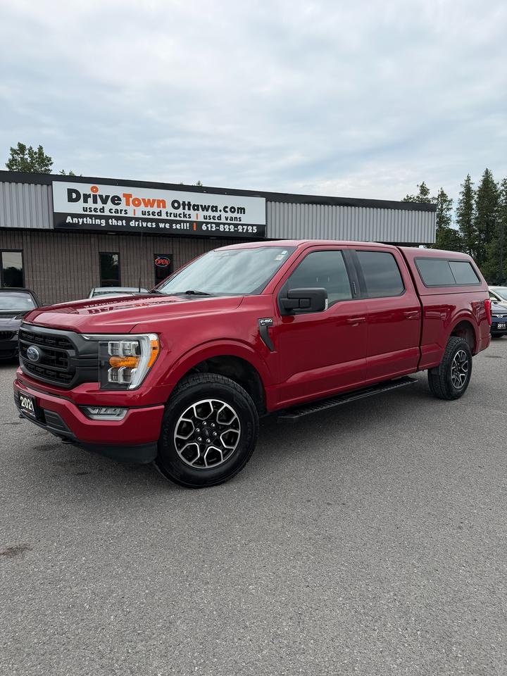 <p>2021 FORD F-150 XLT RED - CLEAN, PRACTICAL & READY TO WORK!</p><p>VERY CLEAN - SHARP LOOKING F-150 XLT WITH A RED EXTERIOR AND A SMOOTH, COMFORTABLE & CONFIDENT DRIVE!</p><p>TRUCK CAP ON THE BACK - GREAT FOR COVERED STORAGE, TOOLS, EQUIPMENT, WORK USE OR EVERYDAY PRACTICALITY!</p><p>XLT TRIM WELL EQUIPPED WITH PRACTICAL FEATURES INCLUDING BACKUP CAMERA, BLUETOOTH, TOUCHSCREEN DISPLAY, CRUISE CONTROL, POWER WINDOWS, POWER LOCKS & A COMFORTABLE INTERIOR!</p><p>FULL-SIZE TRUCK DESIGN WITH PLENTY OF SPACE, PRACTICALITY AND THE CAPABILITY YOU EXPECT FROM AN F-150!</p><p>PERFECT FOR WORK, HAULING, CONTRACTORS, FAMILY USE OR ANYONE LOOKING FOR A CLEAN, MODERN & PRACTICAL FULL-SIZE TRUCK WITH COVERED STORAGE!</p><p>EASY FINANCING AVAILABLE!</p><p>ADVERTISED PRICE IS OUR FINANCE PRICE.</p><p>DRIVETOWNOTTAWA.COM - COME VISIT US / VENEZ NOUS VISITER!</p><p>TAXES AND LICENSING EXTRA. SEE DRIVETOWNOTTAWA.COM FOR CASH PRICE. FINANCING CHARGES APPLY, INCLUDING BANK FEES, PPSA AND INTEREST. QUEBEC SAFETY FEE APPLICABLE.</p>