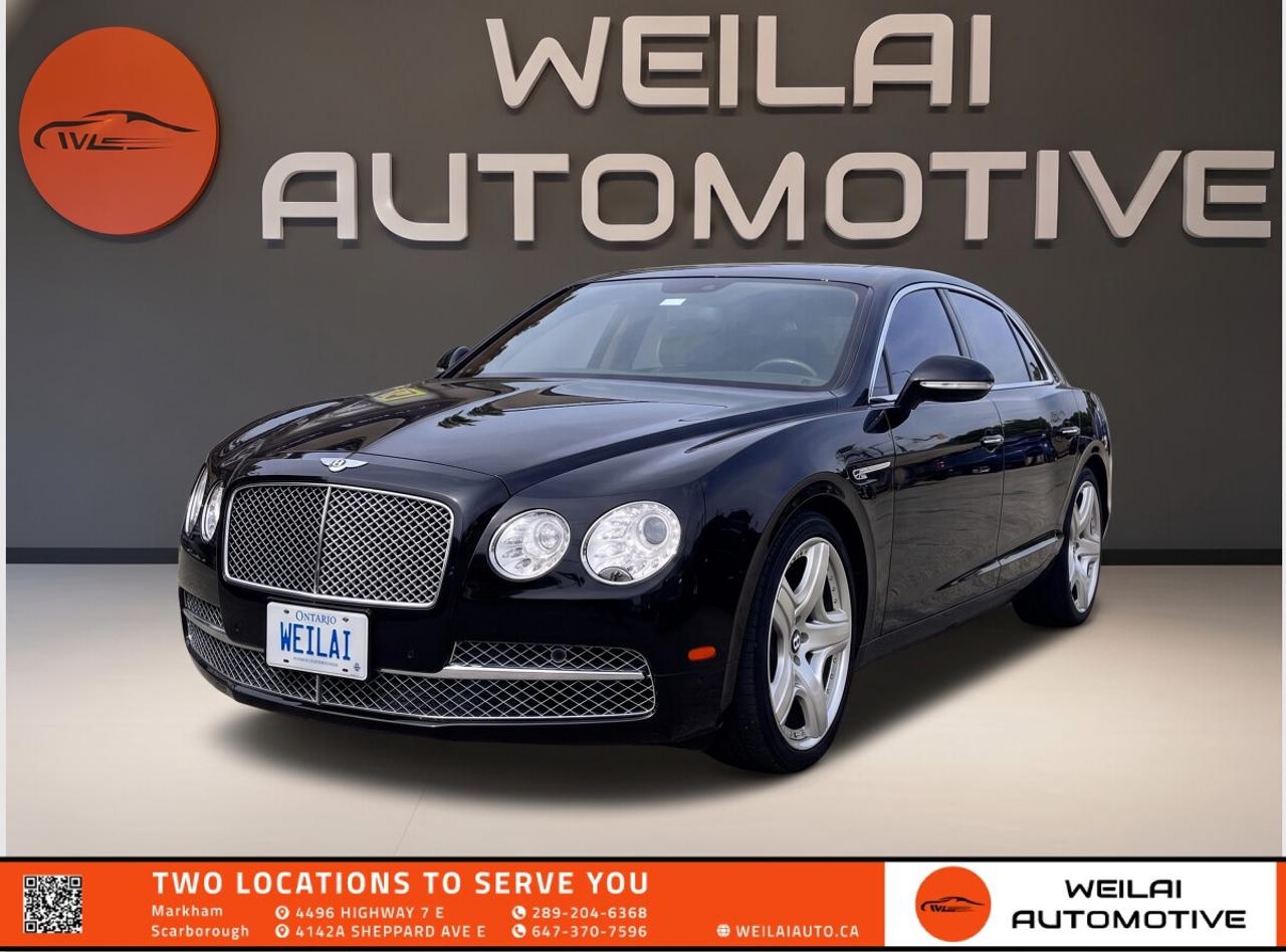 6.0L Twin-Turbo W12 | 21-Inch Alloy Rims | Comfort Package | Diamond Quilted Leather | Wood and Hide Steering Wheel |<br/> <br/> Test Drive the 2015 Bentley Flying Spur W12 Today! Experience the absolute pinnacle of British luxury and blistering performance with this magnificent ultra-luxury sedan. Combining a handcrafted interior, unmatched road presence, and a monstrous W12 engine, this Flying Spur delivers a driving experience unlike any other. Whether you are behind the wheel or relaxing in the opulent rear cabin, every journey feels like a first-class event. <br/> PerformanceEngine: 6.0L Twin-Turbocharged W12 <br/> Horsepower: 616 hp <br/> Torque: 590 lb-ft <br/> Transmission: 8-Speed Automatic <br/> Drivetrain: AWD <br/> Exterior21-inch premium alloy rims <br/> Bi-Xenon projector headlamps with LED signature daytime running lights <br/> Twin oval stainless steel exhaust tailpipes <br/> Power glass tilt and slide sunroof <br/> Power-latching soft-close doors <br/> InteriorPremium diamond-quilted leather seating surfaces <br/> Comfort Package featuring heated, ventilated, and massage seats <br/> Hand-crafted wood and hide multi-function steering wheel <br/> Genuine wood veneer interior trim accents <br/> Four-zone automatic climate control system <br/> Technology8-inch high-resolution touchscreen infotainment display <br/> Satellite navigation system with voice guidance <br/> Bluetooth hands-free phone and audio streaming connectivity <br/> Touch Screen Remote for rear passenger climate and infotainment control <br/> Premium multi-speaker Bentley audio system <br/> SafetyFront and rear parking sensors with rearview camera system <br/> Electronic Stability Program with Traction Control <br/> Advanced front, side, and curtain airbag system <br/> Anti-lock Braking System with Electronic Brake-force Distribution <br/> Tire Pressure Monitoring System <br/> Approximate Fuel EfficiencyCity: 19.6 L/100 km <br/> Highway: 11.8 L/100 km! <br/> This pristine W12 masterpiece is a highly sought-after model and will not last long in our showroom. Inventory of this caliber is incredibly hot right now and moves fast. Contact Weilai Automotive Inc. immediately to secure your exclusive test drive and take this incredible luxury vehicle home today! <br/> <br/> <br/> FINANCINGAt Weilai Automotive Inc., were all about giving everyone a fair shot at owning a quality vehicle, no matter their credit history. Whether youre grappling with credit challenges or have a stellar credit record, we have financing options that cater to you. Your specific financing terms will depend on various factors, including your credit rating. For a personalized finance consultation, a signed consent form is needed. Reach out to schedule your appointment today. <br/> WEILAI CERTIFIED PRE-OWNED PROGRAM:*Full Detailing Package <br/> Comprehensive Certification Package <br/> Safety Certification <br/> Financing Available <br/> Extended Warranty Available <br/> Available for only $899 <br/> *Weilai Certified Pre-Owned Program includes: Full interior detailing, full exterior detailing, meticulous vehicle reconditioning. A comprehensive 60-point safety inspection with additional standards. For example, tire and brake treads must be a minimum of 3.5 mm which is 233% of the Ontario standard of 1.5 mm. Access to a large network of lenders to give you the best approval guaranteed. Option to extend the warranty for up to an additional 6 years for an additional fee. <br/> CARFAX REPORTWe believe in full transparency. All vehicles come with a FREE Carfax report. Please visit our listing on weilaiauto.ca or autotrader.ca to obtain your free Carfax report. <br/> CONTACT NOWWe welcome customers from all over the GTA, including Markham, Scarborough, Barrie, Stouffville, Toronto, Richmond Hill, East Gwillimbury, Aurora, North York, East York, Whitby, Brampton, and the surrounding area. Ready to take the next step? Book an appointment, get more info, or get in touch by calling 289-204-6368 or emailing us at salesmanagers@weilaiauto.ca. <br/> <br/> <br/> FEE DISCLOSURE: Price does not include safety certification, HST, or licensing fees. Safety certification available, see the Weilai Certified Pre-Owned Program for details. <br/> FINANCE SPECIAL PRICE ONLY: Pricing is based on financing. The listed price includes a $1,000 finance rebate. Choosing an alternative payment method may disqualify this rebate. <br/> VEHICLE CONDITION: The vehicle has been inspected and reconditioned to a premium pre-owned condition and is ready to be test-driven. However, to comply with OMVICs disclosure requirements, please note that this unit is not currently drivable and not certified until it undergoes safety certification. <br/> DISCLAIMERS: Please note that these details are based on the typical specifications for a given year, make, and model, and actual features may vary for the specific VIN provided. The descriptions above and the contents on this vehicle detail page are generated using AI and VIN decoders, which may contain inaccuracies. They are intended for reference only and may not be entirely reliable. Always check the vehicles actual specifications and refer to the owners manual for the most precise and up-to-date information. While Weilai Automotive Inc. strives to provide accurate information, we will not be responsible for any mistakes made on this page. <br/>