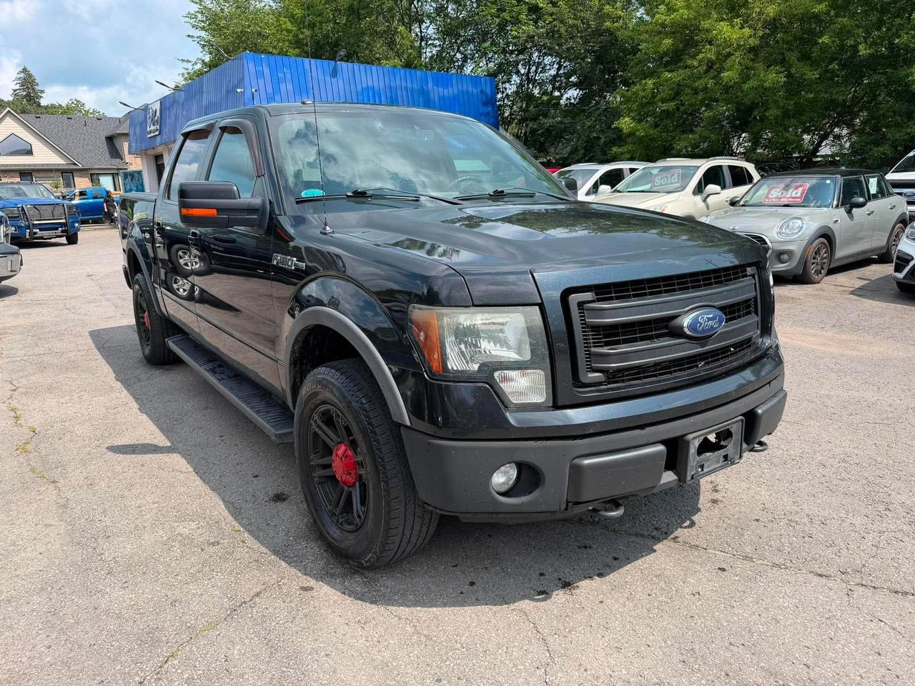 <h1> 2014 FORD F-150 SUPERCREW FX4 4X4 &mdash; V8 POWER & SERIOUS TRUCK CAPABILITY! </h1><h2> BUILT FOR THE JOB. READY FOR THE WEEKEND.</h2><p class=isSelectedEnd>Looking for a <strong>full-size 4X4 truck that delivers V8 power, a spacious SuperCrew cab, and serious capability without the new-truck price tag?</strong></p><p class=isSelectedEnd>Take a look at this <strong>2014 Ford F-150 SuperCrew FX4</strong>!</p><p class=isSelectedEnd>Finished in <strong>Black with a Grey interior</strong>, this F-150 brings together the capability of <strong>4-wheel drive</strong>, the strength of an <strong>8-cylinder engine</strong>, and the practicality of a full-size crew cab.</p><h3> TRUCK HIGHLIGHTS</h3><p class=isSelectedEnd> <strong>2014 Ford F-150 SuperCrew FX4</strong><br> <strong>4-Wheel Drive (4X4)</strong> <br> <strong>8-Cylinder Engine</strong><br> <strong>Automatic Transmission</strong><br> <strong>258,150 KM</strong><br> <strong>Safety Certified</strong><br> <strong>145 Wheelbase</strong><br> <strong>Tow Hooks</strong><br> <strong>Stability & Traction Control</strong><br> <strong>Power Windows & Mirrors</strong><br> <strong>Power Door Locks</strong><br> <strong>Keyless Entry</strong><br> <strong>Air Conditioning</strong> <br> <strong>Driver Adjustable Lumbar</strong><br> <strong>Pass-Through Rear Seat</strong><br> <strong>AM/FM Audio</strong><br> <strong>4-Wheel Disc Brakes</strong><br> <strong>Crew Cab Comfort & Space</strong></p><p class=isSelectedEnd>Whether you need a truck for <strong>work, towing, hauling, winter driving, or weekend adventures</strong>, this F-150 is ready to get the job done.</p><h3> ONLY $14,999 + TAX & LICENSING!</h3><p class=isSelectedEnd>Youre getting a <strong>Safety Certified V8-powered 4X4 SuperCrew</strong> at a price thats hard to ignore.</p><p class=isSelectedEnd> <strong>V8 POWER &bull; 4X4 &bull; FX4 &bull; SUPERCREW &bull; SAFETY CERTIFIED</strong></p><p class=isSelectedEnd>Dont wait &mdash; affordable 4X4 trucks with this kind of capability dont stay available forever!</p><p class=isSelectedEnd> <strong>Stewart Auto Hub Inc.</strong><br>421 King St. E, Cobourg, Ontario</p><p class=isSelectedEnd> <strong>905-269-5995</strong></p><p class=isSelectedEnd> <strong>Come see it, take it for a drive, and put this F-150 to work!</strong></p><p><em>Price excludes taxes and a $59 licensing fee.</em></p>