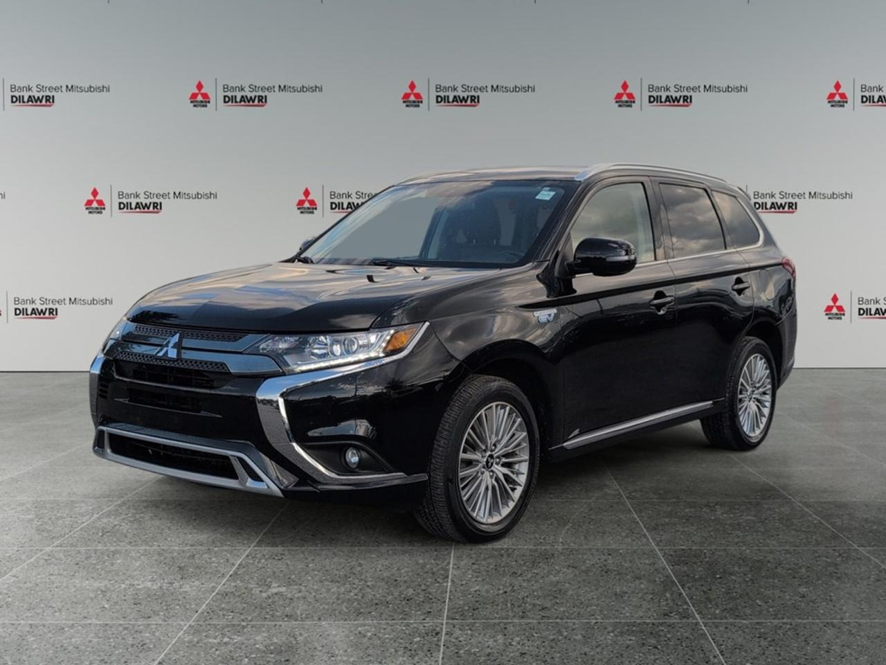 Balance of 5 year/100,000kms BASIC warranty and 10 year/160,000kms Factory Powertrain Warranty on ALL MITSUBISHI products! Best in the industry!!!! The 2022 Mitsubishi Outlander PHEV SE S-AWC in a sophisticated hue offers impressive handling with its 4×4 drivetrain. Perfect for those seeking adventure, this SUV combines style and functionality, ensuring every drive is a pleasure. The exterior is highlighted by sleek alloy wheels that complement its bold design, while the interior offers comfort with features like heated seats and power-adjustable seating. The spacious cabin, accentuated by modern finishes, is perfect for both families and outdoor enthusiasts. Technology enthusiasts will appreciate the smart device integration, allowing seamless connectivity on the go. The integrated backup camera and lane assist enhance safety, providing peace of mind during every journey. Additionally, the Outlander PHEV is equipped with advanced driver assistance features such as brake assist and cruise control. Whether youre a tech-savvy commuter or an adventure-ready family, the Mitsubishi Outlander PHEV SE S-AWC is tailored to suit your needs. Contact Bank Street Mitsubishi to schedule a test drive and experience everything this remarkable SUV has to offer.
