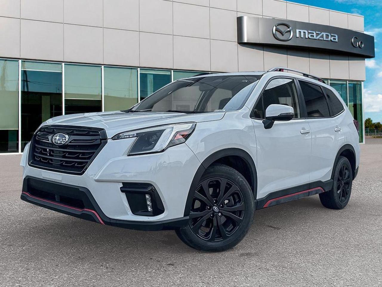 **2023 SubaruForester Sport  PreOwned, WhiteExterior, BlackInterior**Ready for every road, every weather, and every adventure, this 2023 Forester Sport blends Subarus legendary AWD capability with premium comfort and the latest safety techall at a great preowned price.**Why this Forester stands out**- **Power & Efficiency:** 2.5L DirectInjection Boxer 4cylinder paired with the Lineartronic 7speed CVT delivers smooth acceleration, auto stopstart fuel savings, and a 3.700 axle ratio for confident lowspeed control.- **AllWheel Drive & Traction:** Fulltime AWD, allspeed ABS, hilldescent control, and electronic stability control keep you planted on wet, snowy or rough surfaces.- **Comfort & Convenience:** Front heated bucket seats, dualzone automatic climate control, poweradjustable driver seat with 8way controls, heated steering wheel, and a power liftgate make daily use effortless.- **Tech & Safety Suite:** 8inch touchscreen with smartphone mirroring, rearview camera, LED adaptive headlights, lanedeparture prevention, forwardcollision mitigation, blindspot warning, and a total of seven airbags give you confidence behind the wheel.- **Utility:** 18inch split5spoke alloy wheels wrapped in 225/55R18 allseason tires, roof rails, rear cargoarea light, and a spacious 6040 folding rear seat provide the cargo flexibility to sport gear, groceries or a weekend getaway.**Key Highlights at a Glance**| Feature | Benefit ||---------|----------|| **Fulltime AWD** | Superior grip in any condition || **Heated Front Seats + Steering Wheel** | Warmth on chilly mornings || **Dualzone Climate Control** | Personalized comfort for driver & passenger || **8inch UConnect Display** | Easy navigation, streaming and vehicle info || **Advanced Safety (EyeSight)** | Lanekeep assist, precollision braking, pedestrian detection || **Power Liftgate & Roof Rails** | Load and unload with minimal effort || **Spare Tire Under Cargo Floor** | Ready for the unexpected |**Bottom line:** This 2023 Subaru Forester Sport offers the rugged confidence of AWD, the comfort of a heated cabin, and a suite of driverassist technologiesall wrapped in a sleek white exterior. Its the perfect blend of practicality and premium feel for anyone who wants to explore without compromise. **Call or stop by today** to take a test drive and see why the Forester remains the goto compact SUV for every lifestyle.Go Mazda is an AMVIC licensed business.Clean CarFax.