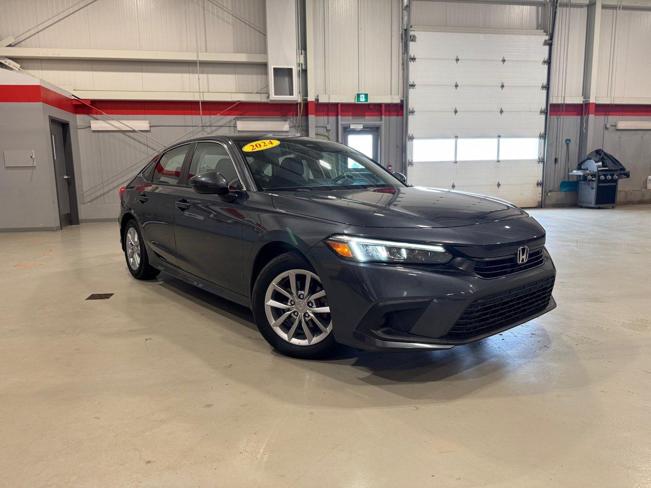 <span>The Honda Civic is part of Canadas automotive heritage. The first Civic arrived in Canada nearly five decades ago. Its been built in Canada for nearly four decades. It was Canadas best-selling car for a quarter-century. You cant separate Canadas vehicular landscape from the Honda Civic.</span>




<span>The Civic is a legend, yet this 2024 Honda Civic is also a class-leading, award-winning, critically acclaimed, modern and high-tech sports sedan. This 2024 Honda Civic EX is the heart of the 11th-generation Civic lineup, exemplified by upmarket content like a sunroof, rain-sensing wipers, dual-zone automatic climate control, and proximity access/pushbutton start. There are also heated front seats, a heated steering wheel, &nbsp;auto high beams, blind spot monitoring, and Honda Sensing (adaptive cruise, lane keeping assist, etc.), and a 7-inch centre screen with Apple CarPlay/Android Auto.</span>




<span style=font-weight: 400;>Thank you for your interest in this vehicle. Its located at Centennial Honda, 515 Central Street, Summerside, PEI. We look forward to hearing from you; call us at 1-902-436-9158.</span>