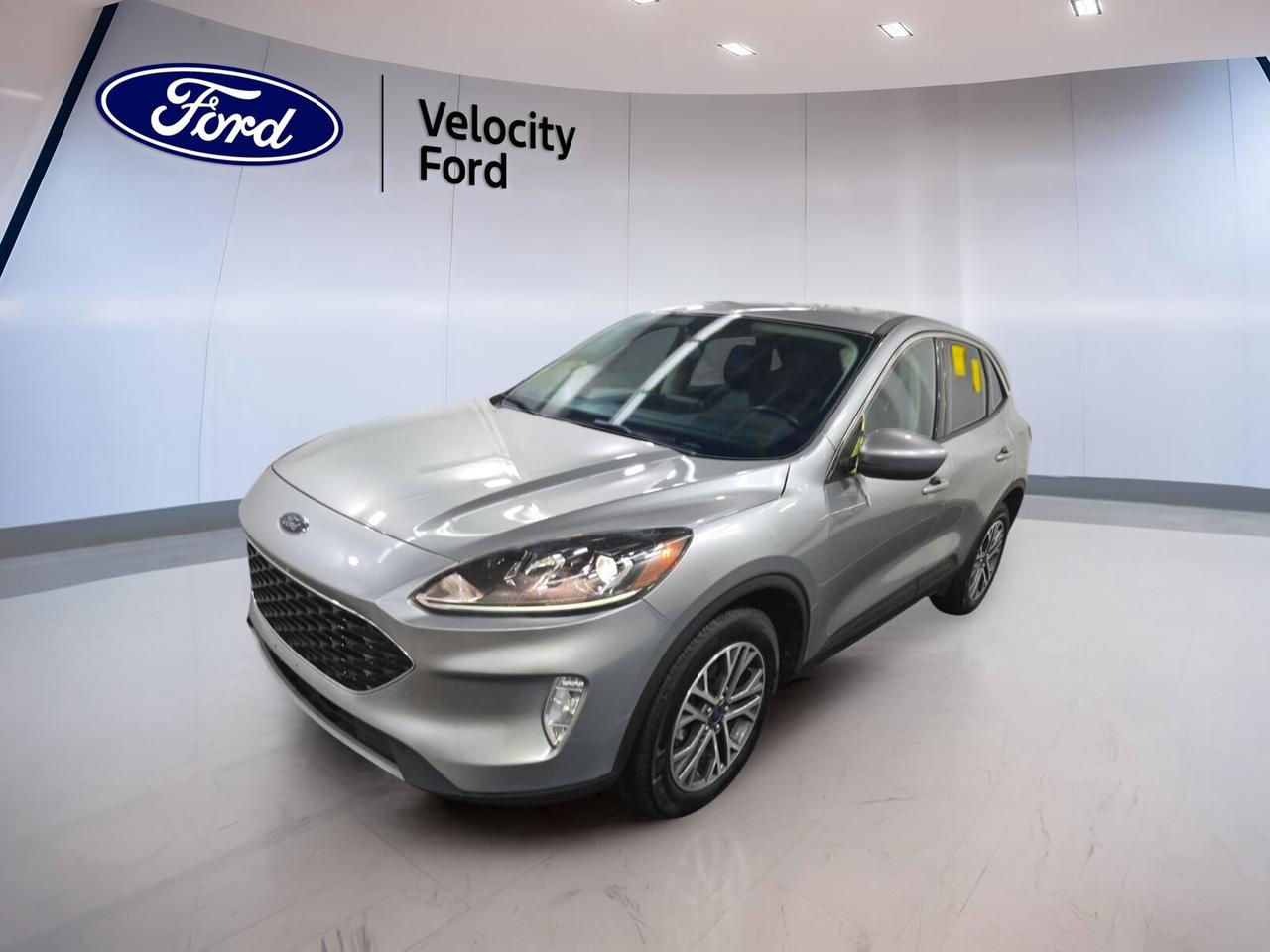// SINGLE OWNER! //

This 2022 Ford Escape SEL AWD at Velocity Ford in Moose Jaw is a smart choice for drivers who want confidence, comfort, and year-round traction. CARFAX Canada reports a single owner, and this used SUV shows strong value with 82,297 km, a silver exterior, black interior, four doors, and an efficient 1.5-litre unleaded engine.

The 2022 Ford Escape SEL AWD blends easy city driving with practical family utility. Its automatic transmission helps deliver smooth daily performance, while all-wheel drive adds extra assurance on wet, snowy, or uneven roads. With a well-equipped feature list and a refined cabin, this Escape is ready for commuting, errands, and weekend travel.

FEATURES OF THE Escape SEL AWD
»» All-wheel drive for four-season road confidence
»» 1.5-litre engine balances power and efficiency
»» Power liftgate adds everyday loading ease
»» Heated front seats boost cold-weather comfort

ADVANCED SAFETY FEATURES
»» Blind spot monitor helps watch traffic
»» Backup camera supports easier reversing
»» Lane departure warning adds extra awareness
»» Side curtain airbags enhance occupant protection

PERFORMANCE AND EFFICIENCY
»» 8-speed automatic delivers smooth shifting performance
»» All-wheel drive improves traction in weather
»» Power steering supports easy urban handling
»» Stability control helps maintain road composure

COMFORT AND CONVENIENCE
»» Dual-zone climate control improves cabin comfort
»» Heated front seats warm cold mornings
»» Remote starter helps prepare the cabin
»» Power driver seat includes lumbar support

TECHNOLOGY AND CONNECTIVITY
»» Bluetooth integration supports hands-free phone use
»» WiFi hotspot adds connection on trips
»» Steering wheel audio controls simplify access
»» Satellite radio expands in-cabin entertainment choices

CARGO SPACE
»» Rear trunk access supports daily practicality
»» Power liftgate helps with busy loading
»» Four-door layout improves passenger entry ease
»» Spare tire adds peace of mind

AWARDS & RECOGNITIONS
»» Top Safety Pick, Insurance Institute for Highway Safety, 2022

WHAT OTHER OWNERS LIKE
»» Comfortable ride for daily driving needs
»» Useful cargo room for family gear
»» Easy controls and user-friendly technology
»» Confident all-wheel drive in winter

Finished in silver with a black interior, this 2022 Ford Escape SEL AWD has a clean, modern look that fits well in any setting. Features like heated mirrors, power windows, tinted windows, fog lights, automatic headlights, push button start, and automatic door locks add welcome convenience to every drive.

This SUV is also equipped with anti-lock braking system, tire pressure monitoring, child safety locks, driver and passenger airbags, passenger airbag sensor, head side airbags, rear window defroster, front air conditioning, illuminated vanity mirrors, and an adjustable steering wheel. It is a practical and well-rounded option for drivers who want useful equipment without unnecessary complexity.

If you want a compact SUV that feels easy to drive, well equipped, and ready for Canadian conditions, this 2022 Ford Escape SEL AWD stands out for the right reasons. Visit Velocity Ford in Moose Jaw to see how this single-owner Escape can fit your lifestyle.

This 2022 Ford Escape SEL AWDs VIN is: 1FMCU9H68NUA50736 .