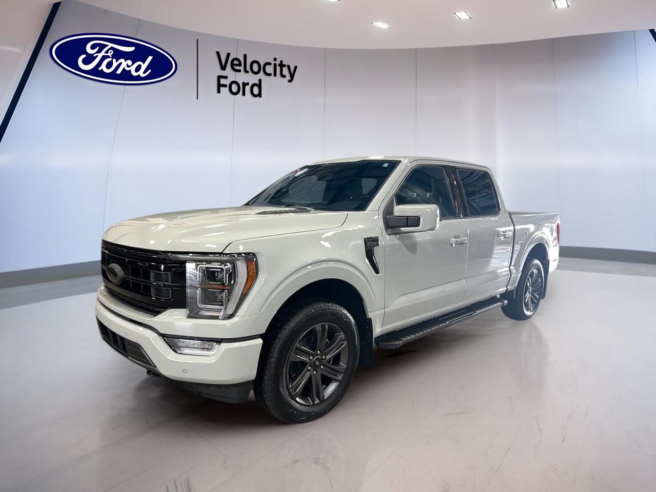 Built for hard work and easy comfort, this used 2023 Ford F-150 LARIAT Sport 4WD SuperCrew 5.5 Box with FX4 Off-Road, Trailer Tow & Black Appearance is ready for life in Moose Jaw. Sold by Velocity Ford, it pairs a White exterior with a Black interior, a smooth automatic transmission, and a 2.7-litre unleaded engine.

With 35,731 km on the odometer, this F-150 LARIAT Sport 4WD SuperCrew 5.5 Box with FX4 Off-Road, Trailer Tow & Black Appearance offers strong capability and smart everyday features. Its four-door SuperCrew layout adds easy access for family, crew, or gear, while the FX4 Off-Road package and trailer tow equipment help it handle tough jobs.

FEATURES OF THE F-150 LARIAT Sport 4WD SuperCrew 5.5 Box With FX4 Off-Road, Trailer Tow & Black Appearance
»» Sport appearance with bold black accents
»» FX4 package adds off-road confidence
»» Trailer tow setup boosts work versatility
»» SuperCrew cab adds roomy rear access

TRUCK FEATURES
»» Tows up to 5,578 kg confidently
»» 5.5-foot box supports daily hauling needs
»» Four-wheel drive aids rough road traction
»» Rear tow hook adds useful recovery support

ADVANCED SAFETY FEATURES
»» Backup camera helps with tight parking
»» Blind spot monitor adds lane awareness
»» Lane departure warning supports safer travel
»» Multiple airbags help protect occupants

PERFORMANCE AND EFFICIENCY
»» 2.7-litre unleaded engine balances power efficiently
»» Automatic transmission delivers smooth daily driving
»» Four-wheel drive improves grip in conditions
»» Stability control supports confident road manners

COMFORT AND CONVENIENCE
»» Heated front seats add cold-weather comfort
»» Dual-zone climate control helps cabin comfort
»» Remote starter adds everyday driving ease
»» Power-adjustable pedals improve driving position

TECHNOLOGY AND CONNECTIVITY
»» Navigation system helps guide every trip
»» Bluetooth integration supports hands-free communication
»» Wi-Fi hotspot keeps devices better connected
»» Satellite radio expands in-cabin entertainment choices

CARGO SPACE
»» SuperCrew cabin adds flexible interior storage
»» Rear access helps load personal gear
»» Box handles tools and weekend supplies
»» Four doors improve passenger and cargo access

AWARDS & RECOGNITIONS
»» Best Buy Award, The Car Guide, 2023
»» Truck of the Year, Auto123.com, 2023

WHAT OTHER OWNERS LIKE
»» Smooth ride for a full-size truck
»» Strong towing ability for work tasks
»» Roomy cabin for family and crew
»» Useful technology for daily driving

This 2023 Ford F-150 LARIAT Sport 4WD SuperCrew 5.5 Box with FX4 Off-Road, Trailer Tow & Black Appearance stands out as a smart choice for drivers who need capability without giving up comfort. It includes cruise control, power steering, anti-lock braking system, heated mirrors, power windows, fog lights, LED headlamps, memory seats, a leather steering wheel, and steering wheel audio controls.

This used truck also brings practical value with tinted windows, automatic headlights, tire pressure monitoring, a spare tire, retractable mirrors, chrome wheels, and off-road tires. Whether you need a dependable tow vehicle, a refined daily driver, or a truck ready for changing prairie conditions, this F-150 is equipped to do the job well.

This 2023 Ford F-150 LARIAT Sport 4WD SuperCrew 5.5 Box With FX4 Off-Road, Trailer Tow & Black Appearances VIN is: 1FTEW1EP9PFD16939.