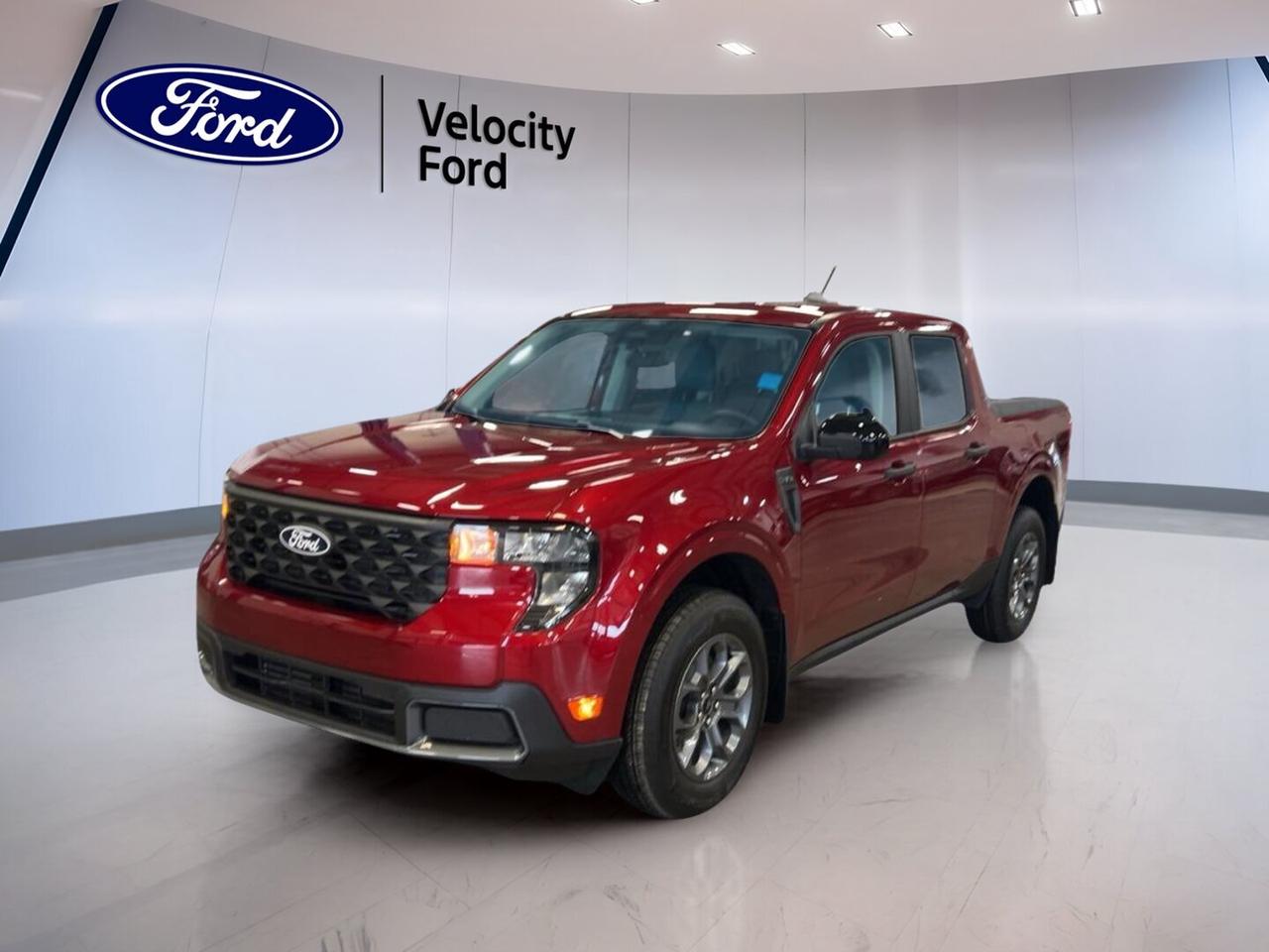 Built for busy days and weekend projects, the brand new 2026 Ford Maverick XLT AWD brings smart size, real truck utility, and easy everyday comfort to Moose Jaw drivers. Finished in Red with a Grey interior, this four-door compact pickup offers confident all-wheel drive, a 2.0-litre unleaded engine, and practical features that make every trip simple.

The 2026 Ford Maverick XLT AWD is a great fit for drivers who want truck capability without the bulk of a full-size pickup. Its compact footprint helps with city parking and tight spaces, while the cabin stays comfortable and useful for commuting, errands, and road trips. This new Maverick also adds the peace of mind of modern safety and driver-assist features.

FEATURES OF THE Maverick XLT AWD
»» All-wheel drive for added year-round traction
»» 2.0-litre engine for capable daily performance
»» Four-door cab with practical passenger access
»» Compact truck size suits urban driving

ADVANCED SAFETY FEATURES
»» Backup camera helps with reversing visibility
»» Lane departure warning supports safer travel
»» Stability control helps maintain vehicle balance
»» Multiple airbags provide added occupant protection

PERFORMANCE AND EFFICIENCY
»» 2.0-litre unleaded engine delivers solid response
»» All-wheel drive adds confidence on roads
»» Automatic transmission supports smooth daily driving
»» Compact truck design helps overall efficiency

COMFORT AND CONVENIENCE
»» Front air conditioning keeps cabin comfortable
»» Automatic climate control adds easy temperature management
»» Cruise control supports relaxed highway driving
»» Power windows and door locks add ease

TECHNOLOGY AND CONNECTIVITY
»» Bluetooth integration supports hands-free phone use
»» WiFi hotspot helps keep devices connected
»» Satellite radio expands in-cabin entertainment choices
»» Steering wheel audio controls simplify adjustments

TRUCK FEATURES
»» Tows up to 907 kg when needed
»» Rear tow hook adds useful truck practicality
»» Four-door layout improves passenger accessibility
»» Compact bed design supports daily hauling

CARGO SPACE
»» Pickup bed handles everyday gear easily
»» Cabin storage helps organize smaller items
»» Four-door design simplifies loading personal items
»» Practical layout supports work and weekend use

WHAT OTHER OWNERS LIKE
»» Easy-to-drive size for daily use
»» Useful truck bed for versatile hauling
»» All-wheel drive confidence through changing seasons
»» Comfortable cabin with practical technology

At Velocity Ford in Moose Jaw, this brand new 2026 Ford Maverick XLT AWD stands out as a smart choice for drivers who need flexibility, efficiency, and truck usefulness in one well-rounded package. Features like LED headlamps, automatic headlights, power steering, anti-lock braking system, tinted windows, electric mirrors, push button start, tire pressure monitoring, child safety locks, and passenger airbag sensor add even more everyday value.

This 2026 Ford Maverick XLT AWDs VIN is: 3FTTW8JA7TRB16947.