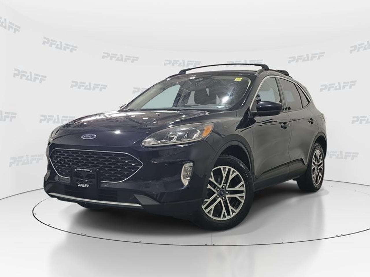 ** This disclosure applied to pre-owned inventory only: The online price includes a $1000 financing credit. For cash purchases, an additional $1000 dollars will be added to the price.*Discover a smart and versatile compact SUV at Honda of Thornhill with this 2021 Ford Escape SEL. Finished in Blue with a Black interior, this used 2021 Ford Escape SEL blends everyday comfort, modern safety, and practical utility in one well-rounded package. With 175,166 km, 4 doors, and an automatic transmission, it is ready to support commuting, family errands, and weekend travel around Thornhill with confidence.This SUV stands out with a feature set that adds real value to daily driving. You get heated front seats, a heated steering wheel, remote starter, power liftgate, backup camera, and advanced driver-assist features that help make every trip easier. The cabin is designed for simple use, while the exterior adds a sporty touch with aluminum wheels, fog lights, heated mirrors, and a rear spoiler.FEATURES OF THE Escape SELBlue exterior with sporty rear spoilerAutomatic transmission for easy daily drivingPower liftgate adds everyday convenienceHeated steering wheel for cold morningsADVANCED SAFETY FEATURESBackup camera supports easier reversingLane departure warning adds awarenessBlind spot monitor helps lane changesCross-traffic alert aids rear visibilityPERFORMANCE AND EFFICIENCYAutomatic transmission delivers smooth operationLimited slip differential adds tractionStability control supports composed handlingTraction control helps on slick roadsCOMFORT AND CONVENIENCEHeated front seats for winter comfortRemote starter warms cabin before drivingCruise control helps on longer tripsPower windows add everyday easeTECHNOLOGY AND CONNECTIVITYBluetooth integration supports hands-free communicationSmart device integration keeps apps accessibleWiFi hotspot adds connected convenienceSteering wheel audio controls simplify useCARGO SPACEPower liftgate improves cargo accessFour-door design supports passenger flexibilityCompact SUV shape balances spaceRear area suits daily gearAWARDS & RECOGNITIONSTop Safety Pick, Insurance Institute for Highway Safety, 2021Best Buy Award, The Car Guide, 2021WHAT OTHER OWNERS LIKEComfortable ride for daily commutingUser-friendly infotainment and controls layoutHelpful driver-assist safety technologyPractical cargo space and versatilityThis 2021 Ford Escape SEL offers the kind of equipment many drivers want most in a compact SUV. Key features such as Anti-Lock Braking System, child safety locks, tire pressure monitoring, automatic headlights, satellite radio, keyless entry, power steering, and heated mirrors help round out a package built for real Canadian driving needs.At Honda of Thornhill, this used SUV is a strong choice for shoppers who want value, comfort, and useful technology in one vehicle. The Blue exterior gives it a fresh look, while the Black interior keeps the cabin timeless and easy to maintain. If you are looking for a practical pre-owned SUV with desirable features already included, this Ford deserves a closer look.This 2021 Ford Escape SELs VIN is: 1FMCU9H90MUA13964.