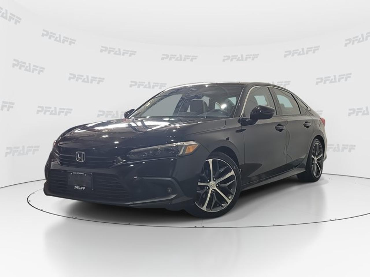 ** This disclosure applied to pre-owned inventory only: The online price includes a $1000 financing credit. For cash purchases, an additional $1000 dollars will be added to the price.*Experience refined comfort and everyday confidence in this used 2024 Honda Civic Touring sedan at Honda of Thornhill in Thornhill. Finished in Black with a Black interior, this four-door Honda Civic Touring blends premium style, proven efficiency, and advanced driver support. With 70,843 km and an automatic transmission, it is ready for smooth commuting and relaxed highway travel.The 2024 Honda Civic Touring stands out with a polished design, strong feature content, and a cabin made for daily ease. This front-wheel drive sedan offers practical value with upscale touches, including heated front seats, a heated steering wheel, leather seats, rain-sensing windshield wipers, and smart connectivity features that help every drive feel simple and connected.FEATURES OF THE Civic TouringBlack exterior with refined sedan stylingAutomatic transmission for smooth daily drivingHeated steering wheel for cold morningsBlind spot monitor adds driving confidenceADVANCED SAFETY FEATURESAnti-lock braking system supports controlled stopsStability control helps maintain road composureLane departure warning adds extra awarenessCross-traffic alert assists when reversingPERFORMANCE AND EFFICIENCYFront-wheel drive supports balanced everyday handlingAutomatic transmission delivers smooth power responsePower steering helps easy urban manoeuvresAdaptive cruise control supports highway comfortCOMFORT AND CONVENIENCEHeated front seats add winter comfortRemote starter helps pre-condition the cabinKeyless entry makes access quick and easyFront air conditioning keeps cabin comfortableTECHNOLOGY AND CONNECTIVITYBluetooth integration supports hands-free communicationSmart device integration keeps apps accessibleWi-Fi hotspot helps passengers stay connectedSatellite radio and HD Radio includedCARGO SPACESedan trunk suits daily errands wellFour-door layout helps passenger accessRear cargo area supports weekend bagsCabin storage helps organize small itemsAWARDS & RECOGNITIONSTop Safety Pick, Insurance Institute for Highway Safety, 2024WHAT OTHER OWNERS LIKEComfortable ride quality for daily commutingEasy-to-use infotainment and connectivity featuresHelpful driver assistance for busy roadsStrong mix of comfort and efficiencyThis used 2024 Honda Civic Touring also includes practical features that drivers appreciate every day. Cruise control helps make longer trips easier, while power windows, heated mirrors, turn signal mirrors, fog lights, and automatic headlights add convenience and visibility in changing conditions. The backup camera helps with parking, and tire pressure monitoring supports peace of mind on the road.Inside, the 2024 Honda Civic Touring offers a premium feel with a leather steering wheel, steering wheel audio controls, an adjustable steering wheel, an auto-dimming rearview mirror, and a layout designed for simple use. The black-on-black finish gives this sedan a clean and upscale look that suits both business and personal driving.For drivers shopping at Honda of Thornhill, this used 2024 Honda Civic Touring is a smart choice for comfort, safety, and modern features in one well-equipped package. It delivers the trusted everyday usability the Civic is known for, along with the upscale details many drivers want in a compact sedan.This 2024 Honda Civic Tourings VIN is: 2HGFE1F97RH002085.