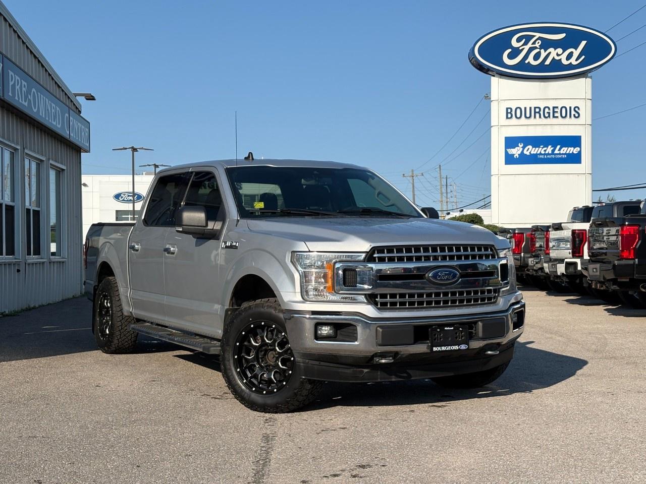 <p>Experience the power and reliability of the 2019 Ford F-150 XLT, a stunning silver truck equipped with 4×4 drivetrain for exceptional handling in any condition. This SuperCrew model with a 5.5' box offers both practicality and style.</p><p>The Ford F-150s silver exterior is complemented by a spacious gray interior that comfortably seats your crew. It comes with keyless entry and power windows that add a touch of modern convenience. This truck promises a comfortable ride courtesy of its well-equipped interior featuring air conditioning to keep you cool on the go.</p><p>Stay connected and secure with the included backup camera, perfect for navigating tight spots, and brake assist for enhanced safety. This truck is ready to handle your day-to-day jobs efficiently and safely.</p><p>If you're searching for a dependable and versatile truck that combines functionality with a touch of class, the 2019 Ford F-150 XLT is your ideal choice. Reach out to Bourgeois Motors Ltd. to learn more about this vehicle and make it yours today!</p> <p><strong>Why Choose the Bourgeois Auto Group?</strong></p><p>For 80 years, Bourgeois Auto Group has been delivering exceptional automotive experiences. Our factor trained teams work to ensure you receive the shopping experience you deserve; whether you're looking for a new or new-to-you vehicle.</p><p>Shop 24/7 with our online showroom and chat service, ensuring convenience every step of the way. No hidden fees, full disclosure, and every pre-owned vehicle comes with a Carfax® report for peace of mind.</p><p>We offer a wide selection of pre-owned vehicles, all competitively priced using real-time market data. Get the best deal on your purchase and trade-in with our free Live Market Analysis report.</p><p>Looking to sell your car? We buy any make or modelno purchase required. Our simple to use online trade valuation tool will provide you with a clear, transparent selling experience whether you buy our car or not.</p><p>Backed by hundreds dedicated employees across 4 convenient locations, were here to meet all your automotive needs. Visit us in Midland or Parry Sound and explore our inventory or schedule your next service today.</p> <p><strong>Financing Your Next Vehicle with Bourgeois Motors Ford in Midland:</strong></p><p>At Bourgeois Motors Ford, we make financing your next vehicle simple and stress-free! Our team works with trusted lenders to find flexible options tailored to your budget. Drive away with confidenceapply today!</p><p>Take advantage of our online pre-qualification tool, backed by Equifax and TD Bank to find the payment that works for you. Simply <a href=https://www.bourgeoismotors.com/free-credit-check/ rel=nofollow><strong>CLICK HERE</strong></a><strong> </strong>to use our secure online credit tool with no impact to your credit.</p>