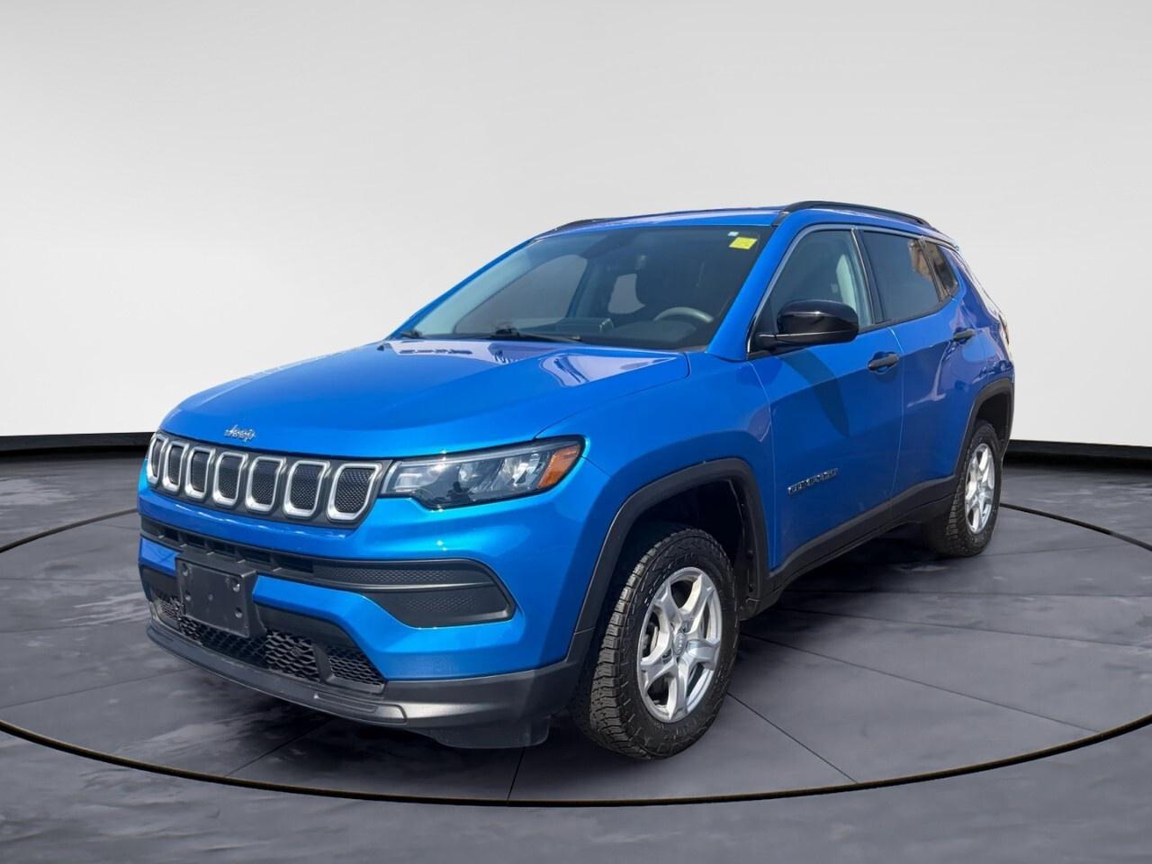 The 2022 Jeep Compass Sport 4x4 in a stunning color promises all-weather capability and exceptional handling with its precise drivetrain. This SUV stands tall with commanding road presence.

Step inside to find a well-appointed interior that blends functionality with style. Comfortable heated front seats await, inviting you on every journey, while heated mirrors ensure clarity during colder months. The spacious cabin, emphasized by a robust body type, offers practical comfort for all occupants.

Tech-savvy drivers will appreciate the array of features including a backup camera for ease of parking, Bluetooth connection for seamless communication, and smart device integration for your convenience. Safety is enhanced with brake assist and keyless entry, ensuring peace of mind wherever the road takes you. Whether youre navigating urban streets or venturing off-road, the Compass delivers stability and control.

This model is ideal for dynamic individuals or families who crave adventure without compromising on comfort and safety. Contact Windsor Chrysler today to find out how you can make this versatile Jeep Compass Sport 4x4 yours for your next journey.