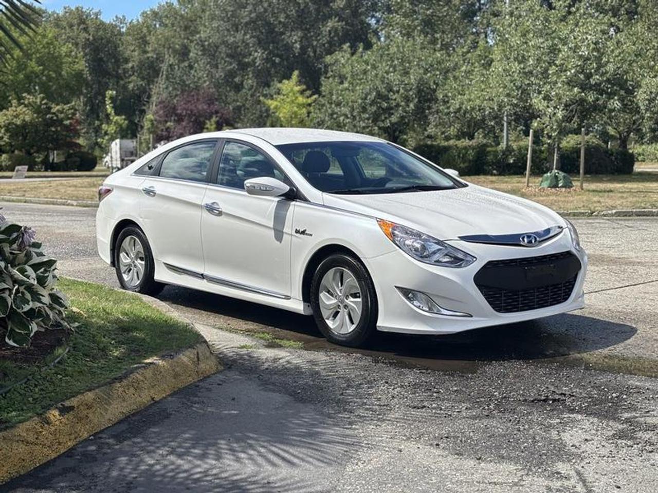 This 2014 Hyundai Sonata Hybrid is powered by a 2.4L 4-cylinder hybrid powertrain paired with an automatic transmission and front-wheel drive. Combining hybrid efficiency with midsize sedan comfort, it is equipped for daily commuting and long-distance travel.

The cabin features heated front seats, dual-zone automatic climate control, heated mirrors, Bluetooth connectivity, a backup camera, AM/FM radio with CD player, cruise control, and ECO Mode to help optimize fuel efficiency. Additional convenience features include power windows, power door locks, power mirrors, and air conditioning and heat.

The vehicle measures approximately 15 feet 10 inches long, 6 feet 1 inch wide, and 4 feet 10 inches high.

Finished in white with a gray cloth interior, this Hyundai Sonata Hybrid offers a spacious interior, practical features, and the benefits of a hybrid powertrain. This item is currently OFFSITE. You must register an appointment with our office to schedule an offsite viewing. Appointments must be made a minimum of one business day in advance (and as defined by the days that Repo.com is open for business) before your appointment can be scheduled and confirmed. We may, at our own discretion, instead opt to transport smaller items to Repo.coms main yard for viewing purposes.  $15,710.00 plus $375 processing fee, $16,085.00 total payment obligation before taxes.   Listing report, warranty, contract commitment cancellation fee. All above specifications and information is considered to be accurate but is not guaranteed and no opinion or advice is given as to whether this item should be purchased. We do not allow test drives due to theft, fraud, acts of vandalism and undetectable impaired driving. Instead we provide the following benefits: Complimentary Warranty (with options to extend), Limited Money Back Satisfaction Guarantee on Fully Completed Contracts, Contract Commitment Cancellation, and an Open-Ended Sell-Back Option. Ask seller for details or call 604-522-REPO(7376) to confirm listing availability.