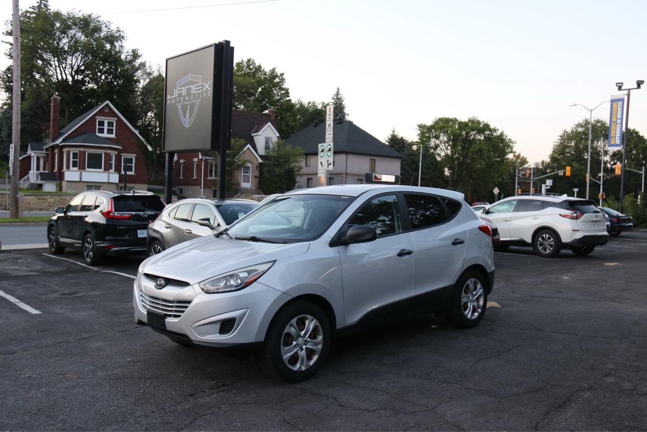 <p>Discover the perfect blend of versatility and value with this 2015 Hyundai Tucson GL, now available at Janex Auto Sales. This sharp silver SUV is ready to tackle your daily commute or weekend adventures, offering a comfortable and reliable ride for you and your passengers. Its practical design, combined with a sleek exterior and a refined black interior, makes it a fantastic choice for anyone seeking a dependable and stylish vehicle. With just 127,538 kilometers on the odometer, this Tucson has plenty of life left to offer.</p><p>Step inside and experience the comfortable black interior, designed for your convenience and enjoyment. The automatic transmission ensures a smooth and effortless driving experience, while the front-wheel drive provides confident handling. Whether youre navigating city streets or heading out for a road trip, this Hyundai Tucson GL from Janex Auto Sales is a smart and sensible option that wont disappoint.</p><p>Here are 5 sizzling features of this 2015 Hyundai Tucson GL:</p><ul><li><strong>Spacious SUV / Crossover Body Style:</strong> Ample room for passengers and cargo, making it perfect for families, gear hauling, and everyday versatility.</li><li><strong>Smooth Automatic Transmission:</strong> Enjoy effortless shifting and a comfortable driving experience, ideal for both city driving and highway cruising.</li><li><strong>Sleek Silver Exterior:</strong> A timeless and elegant colour that keeps its appeal and is easy to maintain.</li><li><strong>Comfortable Black Interior:</strong> A classic and practical choice that offers a sophisticated feel and is known for its durability.</li><li><strong>Proven Hyundai Reliability:</strong> Benefit from the reputation of a well-built and dependable vehicle, offering peace of mind on every journey.</li></ul><p><strong><em>Powered by AutoIntelligence&trade;</em></strong></p><p>Vehicle information has been generated using artificial intelligence and is provided for informational purposes only. While efforts are made to ensure accuracy, please confirm all details directly with the dealer.</p>