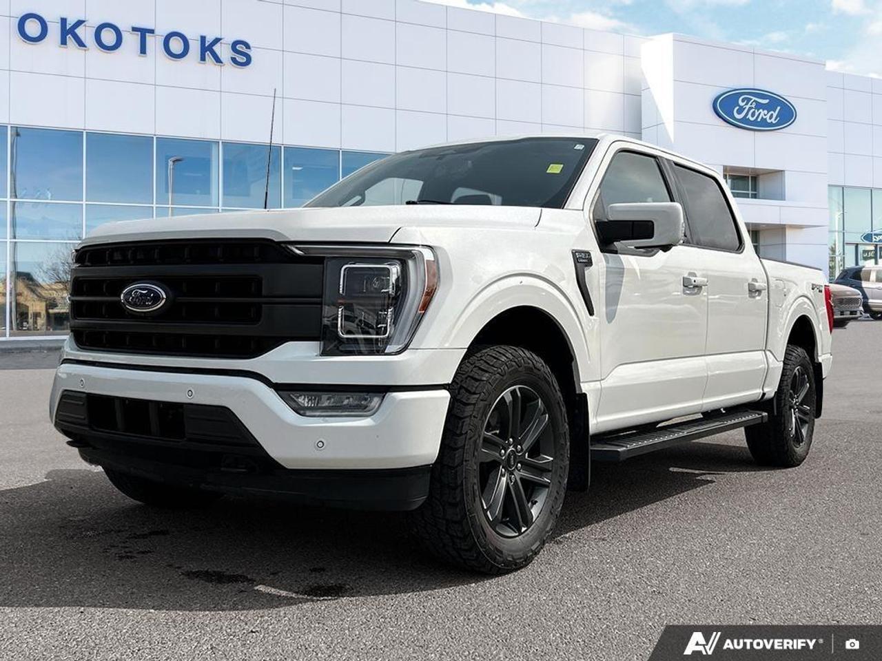 <p>Our One Owner 2023 Ford F-150 Lariat SuperCrew 4X4 with the High and Sport Packs is intelligent, iconic, and impressively strong in Star White Metallic Tri-Coat! Motivated by a 5.0 Litre V8 supplying 400hp to a 10 Speed Automatic transmission for terrific capability. Easy to handle even under heavy loads, this Four Wheel Drive truck also achieves approximately 10.7L/100km on the highway. Our F-150 benefits from a bold design with our High Pack that adds LED Dynamic Bending Headlamps, running boards, and a Class IV hitch to LED fog lamps, body-colored bumpers, dark alloy wheels, a twin-panel sunroof, a tonneau cover, a bed liner, and a SecuriCode keypad.</p><p>Deluxe details await in our Lariat cabin, which treats you to our High Pack that adds a heated second row, B&O audio, wireless charging, and a power leather steering wheel to heated/ventilated leather power front seats, dual-zone automatic climate control, power-adjustable pedals, remote start, and a rear power window. A digital dashboard anchors the infotainment system with a 12-inch driver display and a 12-inch touchscreen to support voice recognition, WiFi compatibility, Android Auto®/Apple CarPlay®, and Bluetooth®.</p><p>Ford promotes peace of mind behind the wheel with our sophisticated High Pack that adds adaptive cruise control and evasive steering assistance to front/rear automatic braking, lane-keeping assistance, blind spot monitoring, forward collision warning, a rearview camera, and other smart features. Now find out for yourself why our F-150 Lariat is so popular! Save this Page and Call for Availability. We Know You Will Enjoy Your Test Drive Towards Ownership!</p><p></p><p>Okotoks Ford Lincoln is an AMVIC licensed dealership. Vehicle available at time of publication. Price excludes GST & fees. Contact dealer for more information.</p>