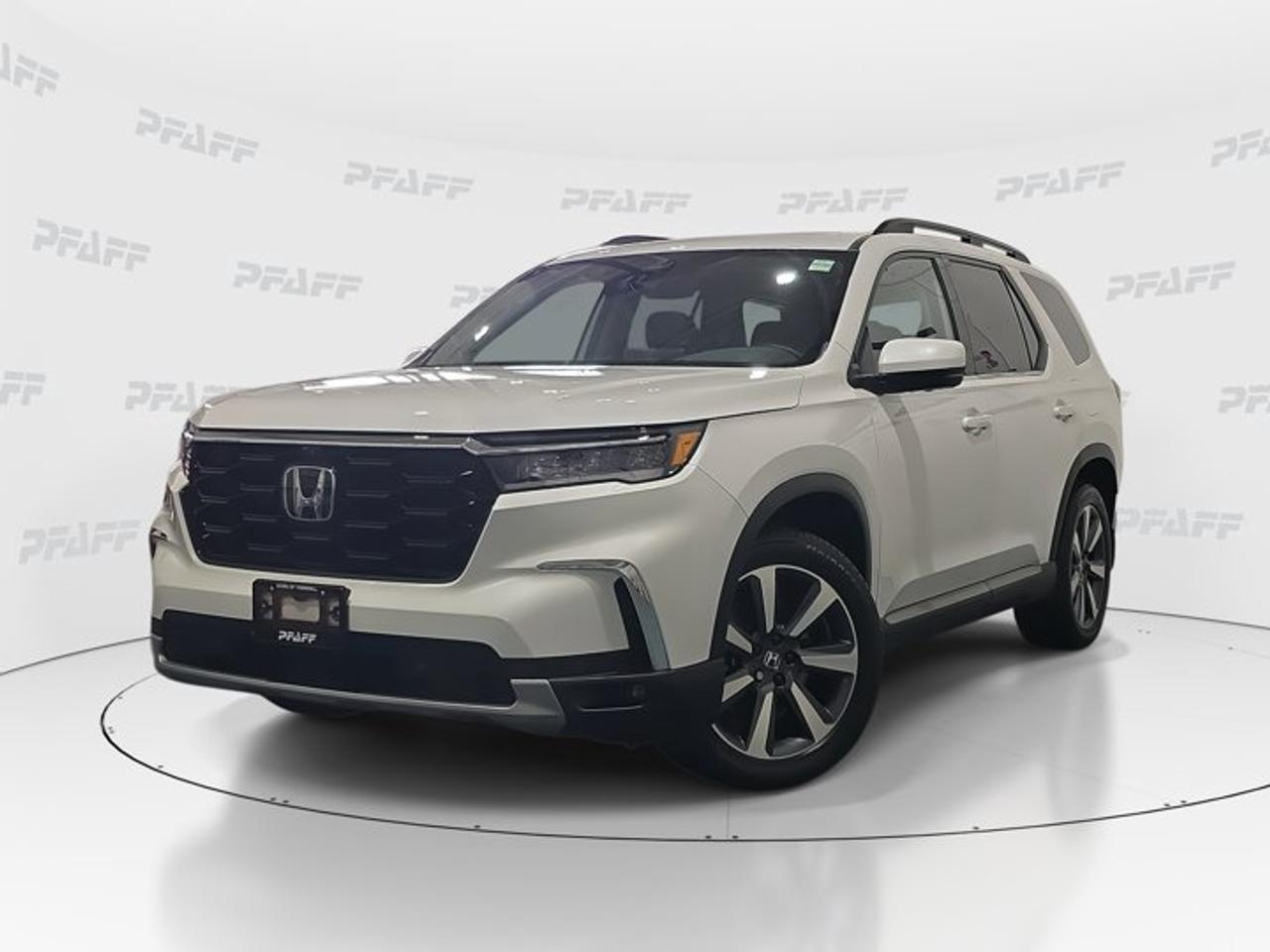 **The online price includes a $1000 financing credit. For cash purchases, an additional $1000 dollars will be added to the price.** This disclosure applied to pre-owned inventory only: The online price includes a $1000 financing credit. For cash purchases, an additional $1000 dollars will be added to the price.*The 2025 Honda Pilot Touring is a smart choice for families who want space, comfort, and confidence on the road. This used SUV at Acura of Thornhill in Thornhill shows 45,100 km and pairs a clean White exterior with everyday versatility, a smooth automatic transmission, and four-door practicality.Designed for busy Canadian life, the 2025 Honda Pilot Touring brings useful features that make each drive easier. From advanced driver assistance to heated comfort and flexible cargo access, this SUV delivers the refinement and utility many shoppers want in a well-equipped three-row Honda.FEATURES OF THE Pilot TouringThree-row SUV with family-focused versatilityAutomatic transmission for smooth everyday drivingPower liftgate adds easy cargo accessHeated steering wheel boosts winter comfortADVANCED SAFETY FEATURESAnti-lock braking system for controlled stopsStability control supports confident handlingBlind spot monitor helps lane changesCross-traffic alert aids safer reversingPERFORMANCE AND EFFICIENCYAutomatic transmission delivers smooth daily drivingPower steering supports easy low-speed manoeuvresLimited slip differential improves traction responseAdaptive cruise control adds highway easeCOMFORT AND CONVENIENCEHeated front seats help cold morningsMemory seats save preferred driving positionsRemote starter warms cabin before entryPower windows add simple daily convenienceTECHNOLOGY AND CONNECTIVITYBluetooth integration supports hands-free phone useSatellite radio expands entertainment choicesWi-Fi hotspot helps keep devices connectedSmart device integration improves media accessCARGO SPACEPower liftgate simplifies loading and unloadingFour-door layout supports family practicalityRear spoiler adds style and utilityVersatile cabin suits errands and travelWHAT OTHER OWNERS LIKEComfortable ride quality for long tripsSpacious cabin for passengers and gearUser-friendly technology for everyday convenienceHelpful driver aids for added confidenceThis used 2025 Honda Pilot Touring also includes many sought-after details that support comfort and visibility. Heated mirrors, turn signal mirrors, automatic headlights, fog lights, rain-sensing windshield wipers, and an auto-dimming rearview mirror all help this Honda feel ready for changing weather and road conditions.Inside, the 2025 Honda Pilot Touring offers a well-finished cabin with practical controls close at hand. Leather seats, a leather steering wheel, steering wheel audio controls, front air conditioning, an adjustable steering wheel, keyless entry, and cruise control all work together to create a relaxed and convenient driving experience.This SUV is also equipped with a backup camera, lane departure warning, traction control, child safety locks, tire pressure monitoring, aluminum wheels, HD Radio, and remote trunk release. At Acura of Thornhill, this 2025 Honda Pilot Touring stands out as a well-equipped used SUV for drivers who value comfort, safety, and everyday usability.This 2025 Honda Pilot Tourings VIN is: 5FNYG1H76SB502246 .