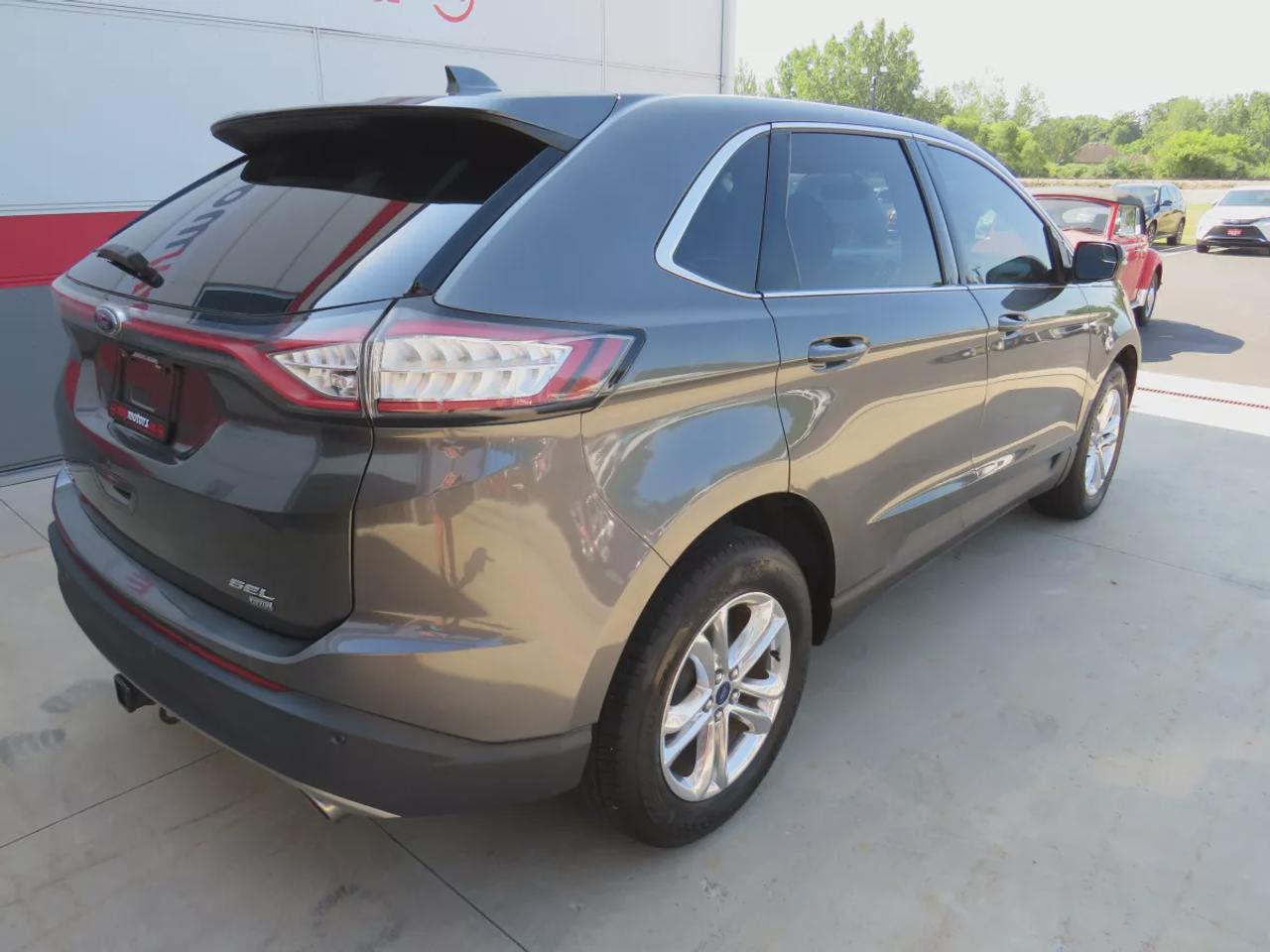 2016 Ford Edge SEL | AWD | Automatic | Alloy Wheels | Panoramic Sunroof | Heated Steering Wheel | Dual Climate Control | Touchscreen Display | Navigation | Bluetooth | Back-Up Camera | Rear Park Assist | Cruise Control | Remote Start | Trailer Tow Package Photo