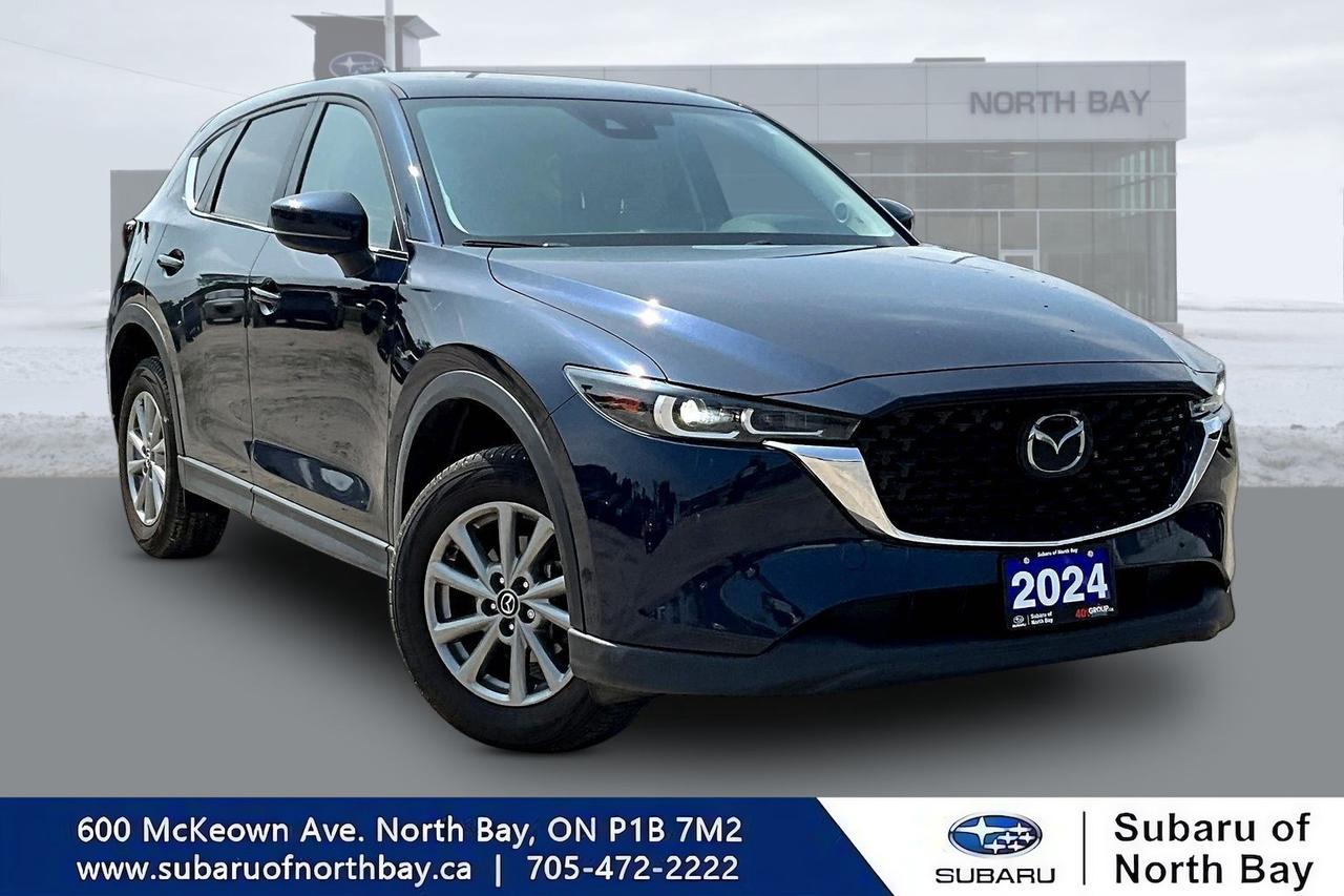Growing up means buying practical vehicles.
			
			It doesnt mean they have to be boring.
			
			The 2024 Mazda CX-5 GS AWD proves you really can have it allsleek styling, outstanding fuel economy, premium comfort, legendary reliability, and handling that actually makes you look forward to driving.
			
			Available now at North Bay Subaru, this award-winning SUV is equally at home cruising through North Bay, navigating Highway 11, heading to Lake Nipissing, or escaping to cottage country for the weekend.
			
			Its the SUV that makes you volunteer to drive... even when everyone else mysteriously forgot their keys.
			
			Vehicle Highlights
			Trim: GS
			Mileage:56000 km 
			Condition: Excellent Condition
			Engine: 2.5L SKYACTIV®-G 4-Cylinder
			Transmission: 6-Speed Automatic
			Drivetrain: i-ACTIV AWD®
			Seating Capacity: 5 Passengers
			Features Youll Love More Than Your Morning Coffee
			Mazda i-ACTIV AWD®
			Apple CarPlay® & Android Auto?
			Heated Front Seats
			Heated Steering Wheel
			Dual-Zone Automatic Climate Control
			Push Button Start
			Blind Spot Monitoring
			Rear Cross Traffic Alert
			Mazda Radar Cruise Control
			Lane Keep Assist
			Rearview Camera
			17-Inch Alloy Wheels
			Remote Keyless Entry
			Premium Interior Finishes
			Built for Northern Ontario... and Northern Ontario Weather
			
			If youve lived around North Bay for any length of time, you know the weather likes to keep everyone guessing.
			
			Snow in April?
			
			Sure.
			
			Sunny one minute, pouring rain the next?
			
			Why not?
			
			Construction cones that seem to hibernate all winter and multiply every spring?
			
			Absolutely.
			
			Thankfully, Mazdas i-ACTIV AWD system doesnt panic. It constantly adjusts to changing road conditions, helping you stay planted whether youre driving through snow, rain, gravel roads, or that parking lot thats somehow always covered in ice.
			
			Practical Meets Premium
			
			The CX-5 GS is proof that sensible doesnt have to mean boring.
			
			The interior feels like it belongs in a luxury SUV.
			
			The ride is smooth.
			
			The steering is sharp.
			
			And unlike some SUVs, it doesnt drive like youre steering a refrigerator with wheels.
			
			Room for Real Life
			
			Groceries?
			
			Easy.
			
			Camping gear?
			
			Bring it.
			
			Hockey bags?
			
			No problem.
			
			A dog thats convinced the back seat belongs exclusively to them?
			
			Theyll approve.
			
			The CX-5 offers plenty of cargo space while staying compact enough to park without needing a spotter and a set of traffic cones.
			
			Why Drivers Love the Mazda CX-5
			
			Because it feels different.
			
			It looks better than most SUVs.
			
			It drives better than most SUVs.
			
			And every time you park it, youll probably glance back just to admire it.
			
			Dont worry...
			
			Thats completely normal.
			
			Perfect for Life Around North Bay
			
			Serving customers throughout North Bay, Callander, Powassan, Corbeil, Astorville, Mattawa, Sturgeon Falls, Temagami, Huntsville, and the entire Nipissing District, this 2024 Mazda CX-5 GS AWD is perfect for commuters, young families, professionals, retirees, and anyone who believes driving should still be enjoyable.
			
			Book Your Test Drive at North Bay Subaru Today
			
			The 2024 Mazda CX-5 GS AWD delivers premium comfort, advanced safety, outstanding fuel economy, and one of the most enjoyable driving experiences in its class.
			
			Contact North Bay Subaru today to schedule your test drive, discuss financing options, or receive top value for your trade.
			
			Because life is too short to drive an SUV that feels like an appliance.
			
			The CX-5 definitely didnt get that memo.
			
			All in price - No hidden fees or charges! We pride ourselves on providing a personalized experience for each of our valued customers. We offer a wide selection of vehicles,. We look forward to seeing you soon. *Every reasonable effort is made to ensure the accur