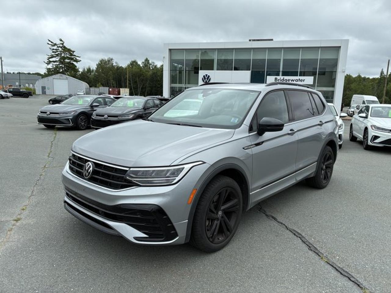 New Price! 2023 Volkswagen Tiguan Comfortline R-Line BlackApple CarPlay | Android Auto | Sirus XM Certified.This vehicle is a Volkswagen Certified Pre-Owned (CPO) model, meeting Volkswagen Canadas certification standards for quality, reliability, and performance. Volkswagen Certified Reconditioning Includes: Comprehensive Volkswagen multi-point inspection Reconditioning completed to Volkswagen Certified standards Verification of vehicle eligibility and service history Professional detailing and final inspection Volkswagen Certified Pre-Owned vehicles include manufacturer-backed benefits. Any concerns related to the certification process must be reviewed and addressed by the original selling dealer.CARFAX Canada No Reported AccidentsPyrite Silver Metallic AWD 8-Speed Automatic with Tiptronic 2.0L TSI AWD, 3.33 Axle Ratio, 4-Wheel Disc Brakes, 6 Speakers, ABS brakes, Air Conditioning, Alloy wheels, AM/FM radio: SiriusXM, Auto-dimming Rear-View mirror, Automatic temperature control, Brake assist, Bumpers: body-colour, Compass, Delay-off headlights, Driver door bin, Driver vanity mirror, Dual front impact airbags, Dual front side impact airbags, Electronic Stability Control, Emergency communication system: VW Car-Net Safe & Secure (4 years included), Exterior Parking Camera Rear, Four wheel independent suspension, Front anti-roll bar, Front Bucket Seats, Front dual zone A/C, Front reading lights, Fully automatic headlights, Heated door mirrors, Heated Front Comfort Seats, Heated front seats, Heated steering wheel, Illuminated entry, Leather Shift Knob, Leather steering wheel, Leatherette Seating Surfaces, Low tire pressure warning, Occupant sensing airbag, Outside temperature display, Overhead airbag, Overhead console, Panic alarm, Passenger door bin, Passenger vanity mirror, Power door mirrors, Power driver seat, Power Liftgate, Power moonroof, Power steering, Power Tailgate Delete, Power windows, Radio data system, Radio: 8.0 Touchscreen Infotainment System, Rain sensing wipers, Rear anti-roll bar, Rear reading lights, Rear window defroster, Rear window wiper, Remote keyless entry, Security system, Speed control, Speed-sensing steering, Split folding rear seat, Spoiler, Sport steering wheel, Standard Suspension, Steering wheel mounted audio controls, Tachometer, Telescoping steering wheel, Tilt steering wheel, Traction control, Trip computer, Turn signal indicator mirrors, Variably intermittent wipers, Wheels: 8.5J x 19 Valencia Black Alloy.