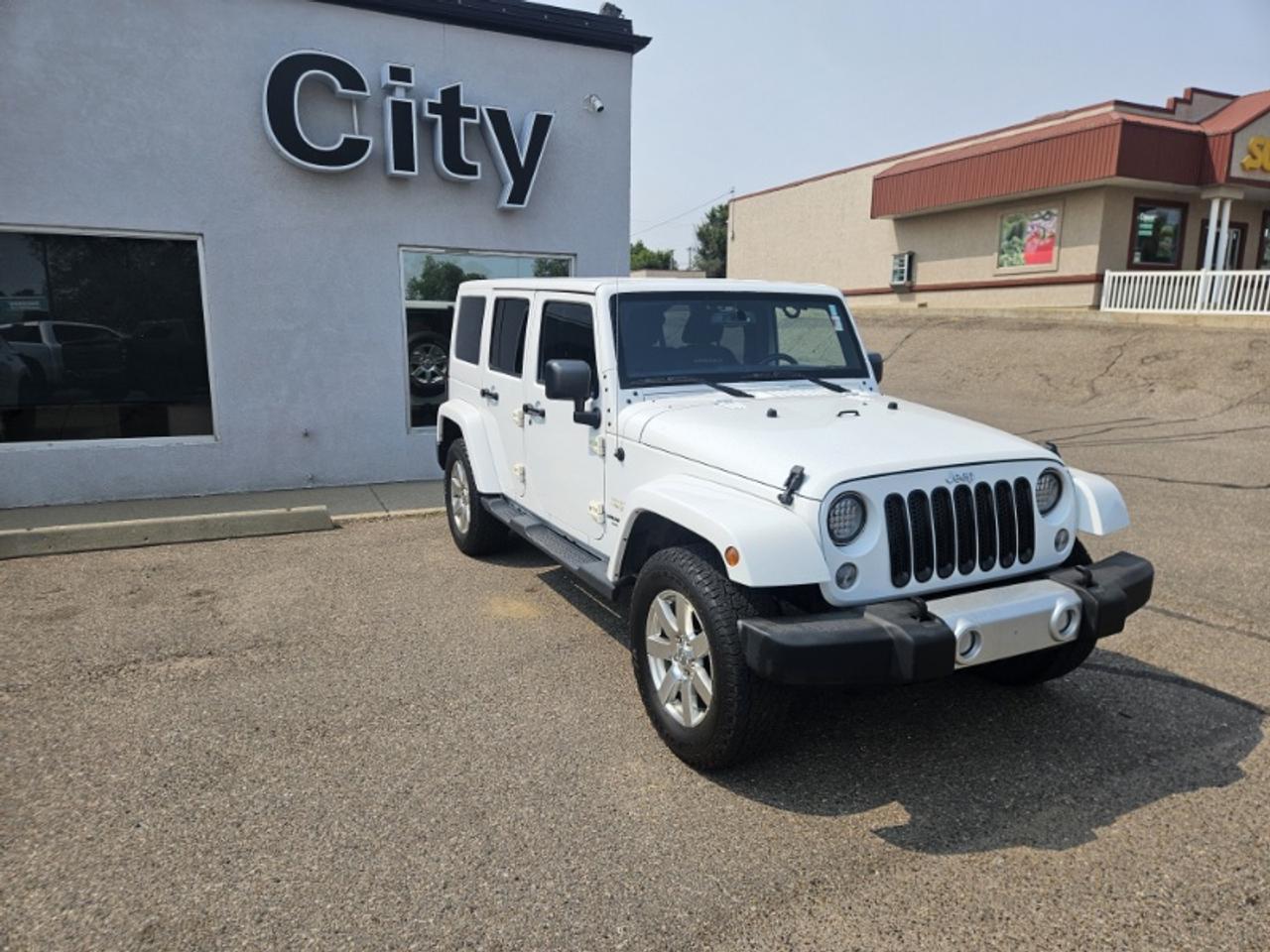 Used 2015 Jeep Wrangler Unlimited Sahara for sale in Medicine Hat, AB
