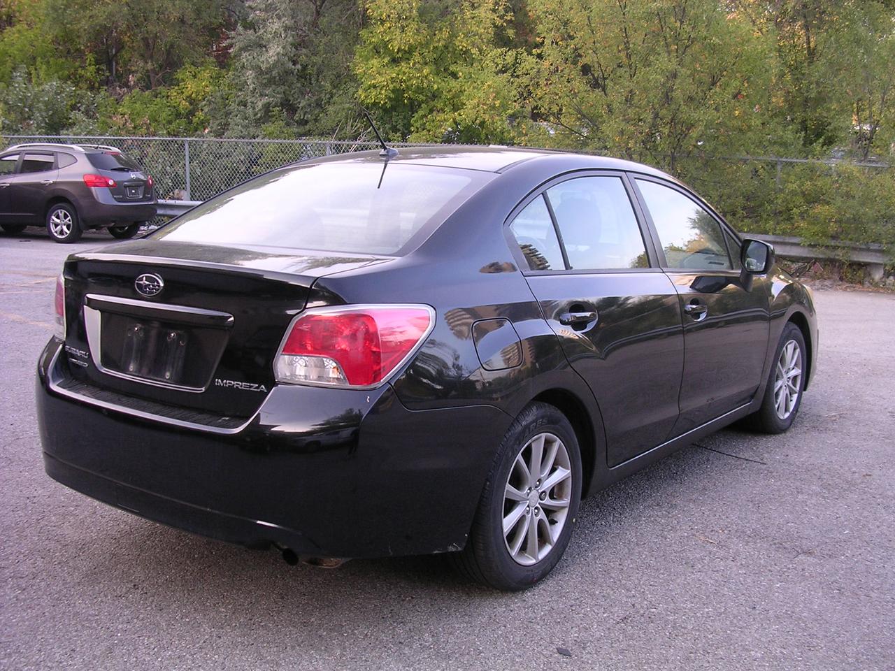2012 Subaru Impreza 4dr Sdn CVT 2.0i w/Touring Pkg Photo