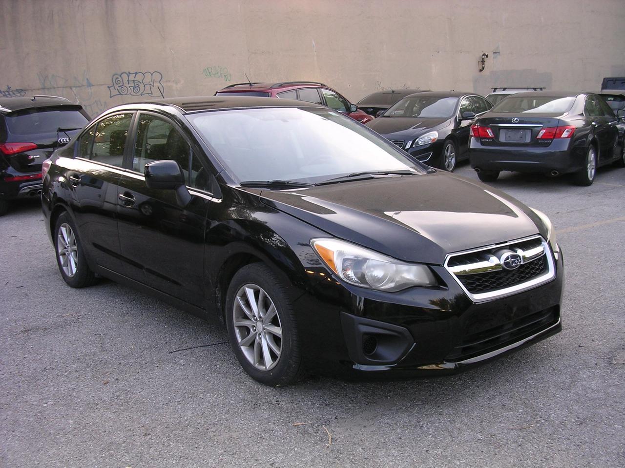 2012 Subaru Impreza 4dr Sdn CVT 2.0i w/Touring Pkg Photo