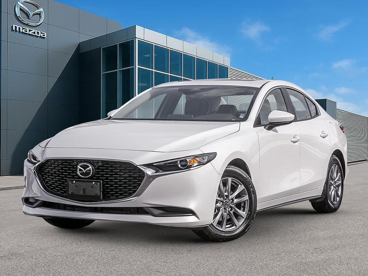 <p>The 2026 Mazda Mazda3 GS FWD in a stunning white finish combines elegance with efficiency, perfectly designed for seamless handling on various terrains. With a smooth automatic transmission and a front-wheel drive system, this sedan ensures a responsive and enjoyable ride.</p><p>The exterior exudes refinement with features like alloy wheels, a power-operated glass moonroof with interior sunshade, and exterior mirrors with reverse tilt down function, all available within the Luxury Package. The Platinum Quartz Metallic adds a touch of sophistication, while the interior's black theme offers a modern ambiance complemented by the leather steering wheel and heated steering functionality.</p><p>Technology and safety blend seamlessly with a suite of options including a backup camera, bluetooth connection, smart device integration, and adaptive cruise control. The auto-dimming interior rearview mirror and 10-way power adjustable driver's seat enhance driving comfort with personalized memory functions.</p><p>Ideal for those who value luxury and functionality, the Mazda3 GS provides practicality for daily commutes and the reliability that comes with advanced safety features like brake assist and lane assist. Contact Cobourg Mazda for more details on this exceptional vehicle or to arrange a test drive. Experience firsthand why this Mazda3 is the right choice for you.</p>