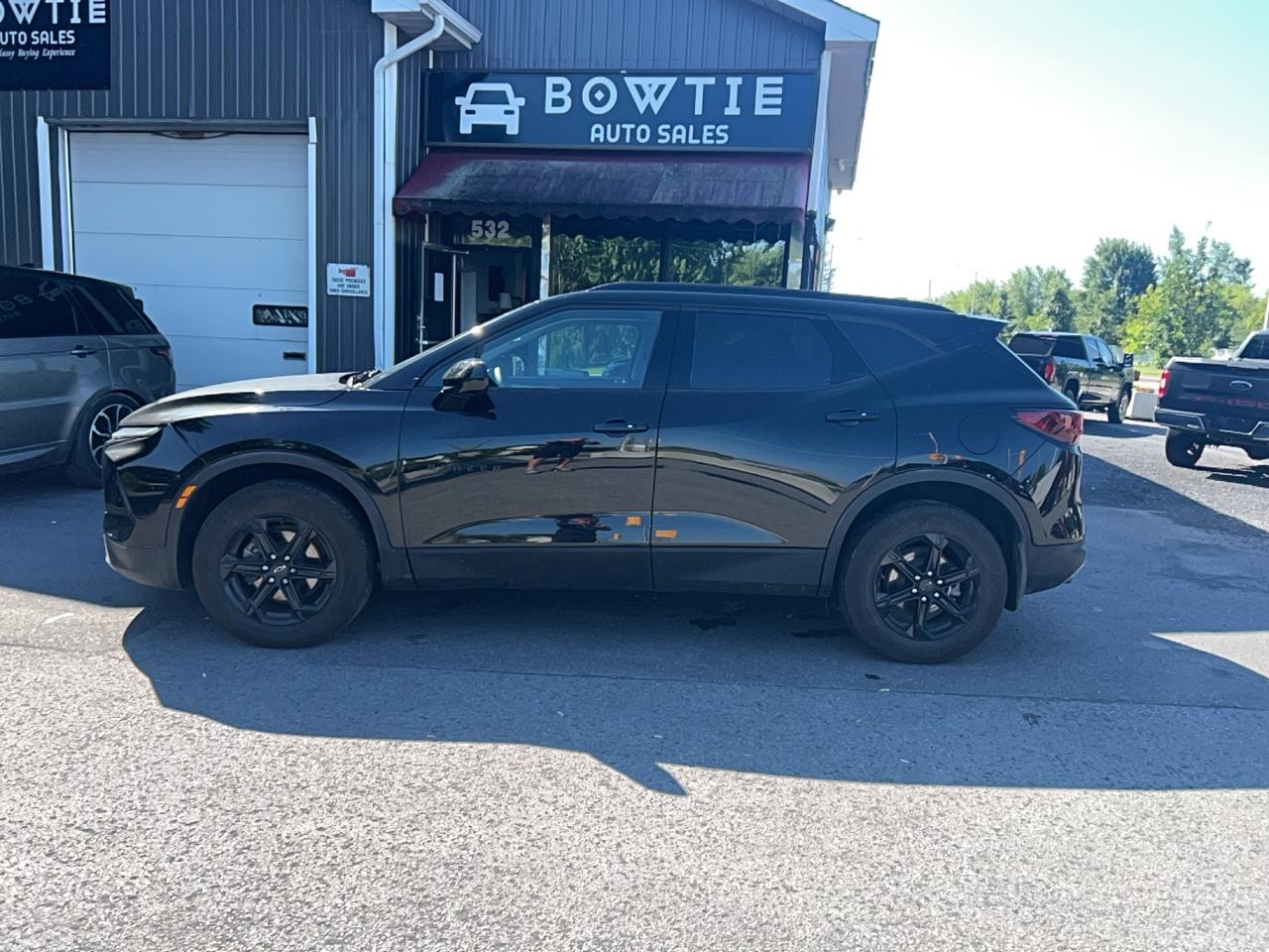 <p class=isSelectedEnd><strong>2024 Chevrolet Blazer RS AWD &ndash; Bold Style, Sporty Performance & Premium Comfort</strong></p><p class=isSelectedEnd>Stand out from the crowd in this <strong>2024 Chevrolet Blazer RS AWD</strong>, a sporty midsize SUV that combines aggressive styling, advanced technology, and confident all-weather capability. Powered by a responsive <strong>3.6L V6 engine</strong> paired with a <strong>9-speed automatic transmission</strong>, the Blazer RS delivers impressive performance while maintaining a smooth and comfortable ride.</p><p class=isSelectedEnd>The RS trim features a striking blacked-out exterior, premium interior finishes, and the latest driver-assistance technologies, making it the perfect SUV for daily commuting, family adventures, or weekend road trips.</p><p class=isSelectedEnd><strong>Key Features:</strong></p><ul data-spread=false><li>3.6L V6 Engine</li><li>9-Speed Automatic Transmission</li><li>All-Wheel Drive (AWD)</li><li>RS Sport Appearance Package</li><li>Leather-Appointed Seating</li><li>Heated Front Seats</li><li>Heated Steering Wheel</li><li>Remote Start</li><li>Dual-Zone Automatic Climate Control</li><li>Power Liftgate</li><li>Wireless Apple CarPlay & Android Auto</li><li>Wireless Phone Charging</li><li>Premium Bose Audio System</li><li>Navigation System</li><li>Panoramic Power Sunroof</li><li>Backup Camera</li><li>HD Surround Vision</li><li>Adaptive Cruise Control</li><li>Blind Spot Monitoring</li><li>Rear Cross Traffic Alert</li><li>Lane Keep Assist with Lane Departure Warning</li><li>Forward Collision Alert with Automatic Emergency Braking</li><li>Front & Rear Parking Sensors</li><li>21-Inch RS Alloy Wheels</li><li>LED Headlights & Daytime Running Lights</li></ul><p class=isSelectedEnd>This <strong>2024 Chevrolet Blazer RS AWD</strong> has been fully inspected and is ready for its next owner. Offering a perfect balance of sporty performance, modern technology, and everyday practicality, its an excellent choice for drivers looking for a premium SUV with standout styling.</p><p><strong>Contact us today to schedule your test drive or ask about our competitive financing options!</strong></p>