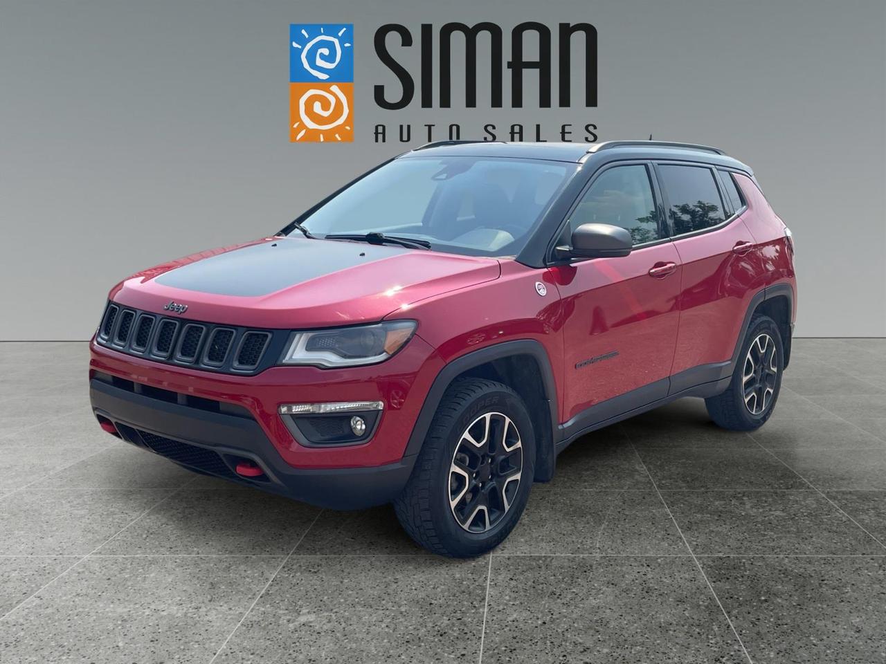 ## 2019 Jeep Compass Trailhawk 4x4  Leather | Panoramic Sunroof | Navigation | Tow Package!

Looking for a rugged SUV thats equally at home on Saskatchewan highways and weekend adventures? This **2019 Jeep Compass Trailhawk 4x4** delivers legendary Jeep capability, premium comfort, and an impressive list of features. With **150,000 km**, this well-maintained Compass has been professionally inspected, freshly serviced, and is ready for its next owner.

Whether youre commuting, heading to the lake, or tackling rough roads, the Trailhawks advanced 4x4 system and premium equipment make every drive enjoyable and confident.

### Freshly Serviced & Ready to Go!

* Presale inspection completed
* Fresh Saskatchewan Safety Inspection
* Fresh full synthetic oil and filter service
* New engine air filter
* New cabin air filter
* Brand new tires installed all around
* New front brake pads and rotors
* Professionally detailed and ready for delivery

### Loaded with Premium Features Including:

* Trailhawk 4x4 Off-Road Package
* Leather Heated Front Seats
* Heated Steering Wheel
* Panoramic Sunroof
* Factory Navigation
* Adaptive Cruise Control (Distance Pacing Cruise)
* Lane Keep Assist
* Rear Backup Camera
* Rear Park Assist Sensors
* Trailer Tow Package
* Premium Alloy Wheels
* Bluetooth Hands-Free Connectivity
* SiriusXM Satellite Radio
* Dual-Zone Automatic Climate Control
* Remote Keyless Entry
* Push-Button Start
* Steering Wheel Audio Controls
* Power Drivers Seat

### Why Buy From Siman Auto Sales?

At Siman Auto Sales, we make buying your next vehicle easy!

* Easy financing available on-site through **16 banks and lenders**
* Trades are always encouraged  **We want your trade!**
* Aftermarket warranties available to fit every need and budget
* Proudly serving Saskatchewan for **over 28 years**
* Over **70 quality pre-owned vehicles** in stock
* Large enough to make a difference, small enough to care

This **2019 Jeep Compass Trailhawk 4x4** offers outstanding value with its premium features, legendary Jeep capability, and exceptional comfort. With brand new tires, new front brakes, a fresh full synthetic oil service, new air filters, and a completed Saskatchewan Safety Inspection, its ready to hit the road with confidence.

**Contact Siman Auto Sales today to schedule your test drive. Quality Jeep Trailhawks loaded with features and priced to sell dont stay on the lot for long!**