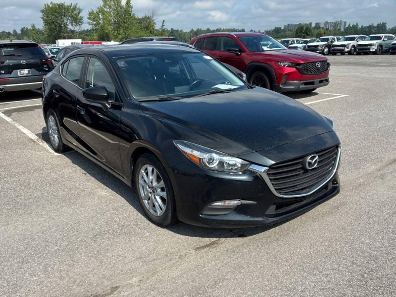 ** ** SPECIAL LIMITED TIME OFFER ** ** PURCHASE ANY VEHICLE THIS WEEK AND RECEIVE 4 BRAND-NEW ALL-SEASON TIRES AT NO ADDITIONAL COST!!! DON   T MISS THIS EXCLUSIVE CHANCE TO UPGRADE YOUR RIDE AND STAY PREPARED FOR ANY WEATHER!!! <br><br>EXCITING NEWS FROM FIRST CHOICE MOTORS! Our brand-new online showroom is now open to the public, bringing the ultimate car shopping experience right to your fingertips! Enjoy a 100% online car shopping experience, with over 500 certified vehicles in stock, comprehensive protection plans, and thousands of new auto parts & accessories available! Plus, for a limited time, were offering FREE deliveries across Ontario on all vehicle purchases! Dont miss out   visit Shop.fcmotors.ca to find and upgrade your perfect vehicle today!<br><br>Welcome to First Choice Motors, the largest car dealership in Toronto of pre-owned cars, SUVs, and vans priced between $5000-$15,000. With an impressive inventory of over 300 vehicles in stock, we are dedicated to providing our customers with a vast selection of affordable and reliable options. <br><br>Were thrilled to offer a used 2018 Mazda MAZDA3 GS Skyactiv, black color with 228,000km (STK#10190) This vehicle was $12990 NOW ON SALE FOR $11990. It is equipped with the following features:<br>- Automatic Transmission<br>- Sunroof<br>- Heated seats<br>- Bluetooth<br>- Reverse camera<br>- Alloy wheels<br>- Power windows<br>- Power locks<br>- Power mirrors<br>- Air Conditioning<br><br>At First Choice Motors, we believe in providing quality vehicles that our customers can depend on. All our vehicles come with a 36-day guarantee on all safety related items. We also offer additional warranty options up to 5 years for our customers who want extra peace of mind.<br><br>Furthermore, all our vehicles are sold fully certified with brand new brakes rotors and pads, a fresh oil change, and brand new set of all-season tires installed & balanced. You can be confident that this car is in excellent condition and ready to hit the road.<br><br>At First Choice Motors, we believe that everyone deserves a chance to own a reliable and affordable vehicle. Thats why we offer financing options with low interest rates starting at 7.9% O.A.C. Were proud to approve all customers, including those with bad credit, no credit, students, and even 9 socials. Our finance team is dedicated to finding the best financing option for you and making the car buying process as smooth and stress-free as possible.<br><br>Our dealership is open 7 days a week to provide you with the best customer service possible. We carry the largest selection of used vehicles for sale under $9990 in all of Ontario. We stock over 300 cars, mostly Hyundai, Chevrolet, Mazda, Honda, Volkswagen, Toyota, Ford, Dodge, Kia, Mitsubishi, Acura, Lexus, and more. With our ongoing sale, you can find your dream car at a price you can afford. Come visit us today and experience why we are the best choice for your next used car purchase!<br><br>All prices include $22.00 OMVIC Fee.  Excludes, license plates, ownership registration and ONTARIO HST (13%)<br>*No Credit Card payments can be accepted for Vehicle Purchases*