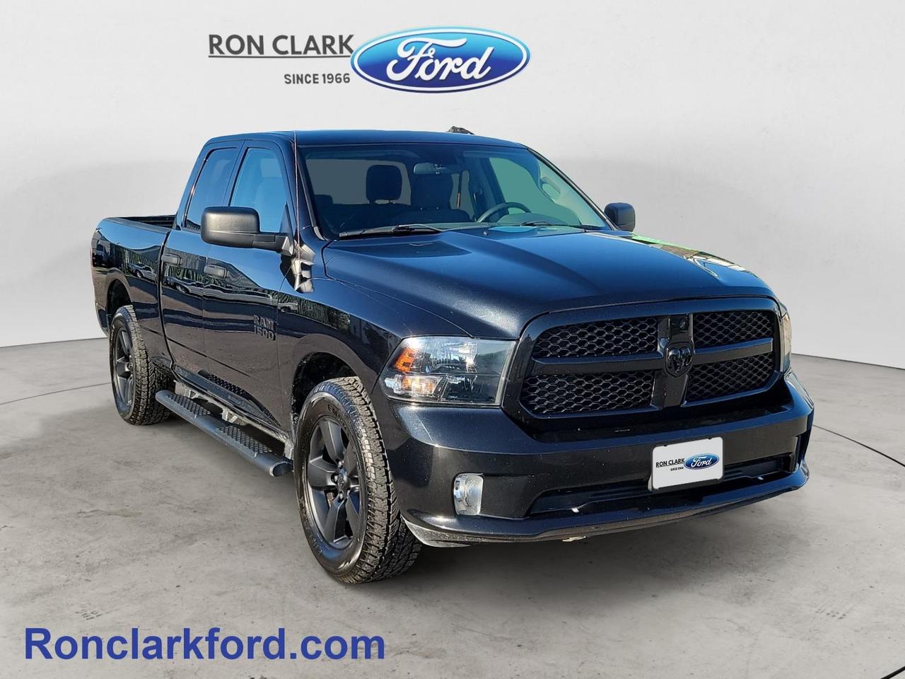 Turn heads wherever you go in this 2018 Ram 1500 Express Quad Cab 4x4, finished in eye-catching Brilliant Black Crystal Pearl with a black interior. Powered by the dependable 3.6L Pentastar VVT V6 engine paired with a smooth 8-speed automatic transmission, this Ram delivers a great balance of capability, efficiency, and everyday comfort.Equipped with the sought-after Blackout Package, this truck has a bold, aggressive look that stands out from the crowd. Inside, youll find practical features including a 5-inch touchscreen display, remote keyless entry, cruise control, manual-adjust front seats, and a rear folding seat with under-seat storage to keep your gear organized and out of sight.Ready to tackle work or weekend adventures, this 4x4 also features a Class IV hitch receiver for towing and a spray-in bedliner to help protect the truck bed from everyday wear and tear.Whether youre looking for a dependable work truck or a stylish daily driver with proven capability, this well-equipped 2018 Ram 1500 Express is ready for whatever comes next. All Pre-Owned vehicles come standard with one key. If we received additional keys from the previous owner they will be with the vehicle upon delivery at no cost. Additional keys may be purchased at customers request and expense.Come to the dealer you can trust. 60 years and counting Ron Clark Ford & Jayco RV is known for great value and being best in customer service! We serve and deliver all over Ontario including destinations such as Wyoming, Petrolia, Sarnia, London, Guelph, Kitchener-Waterloo, Hamilton, GTA, Ottawa & Chatham-Kent. Call or visit us at RON CLARK FORD & JAYCO RV to view and test drive today! RON CLARK FORD where else!!