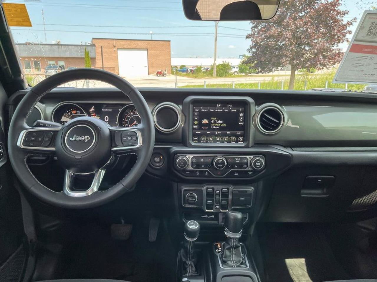 2023 Jeep Wrangler Sahara | One Owner | Clean CarFax | Navigation | Heated Seats & Steering | CarPlay | Android Auto | Photo