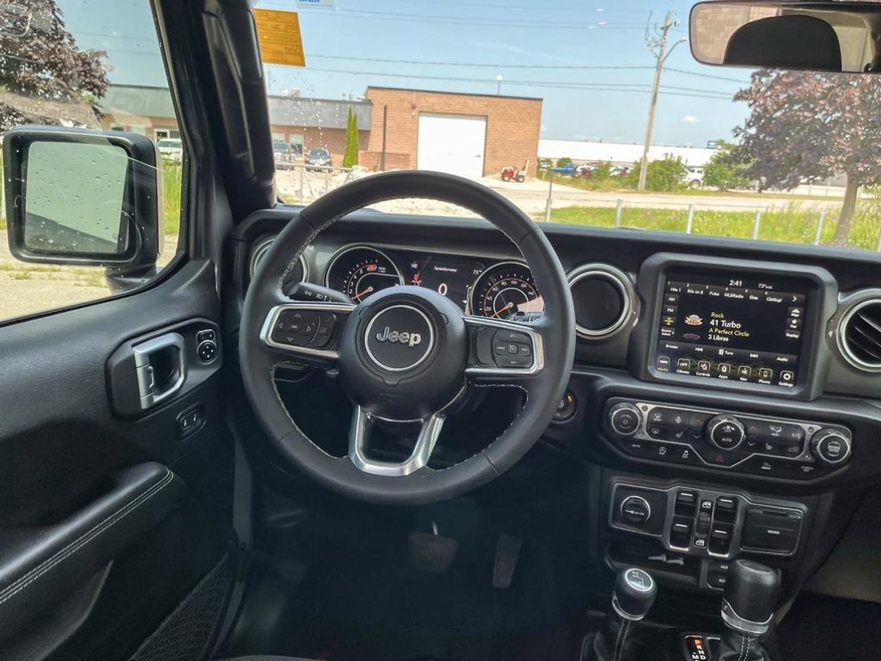 2023 Jeep Wrangler Sahara | One Owner | Clean CarFax | Navigation | Heated Seats & Steering | CarPlay | Android Auto | Photo
