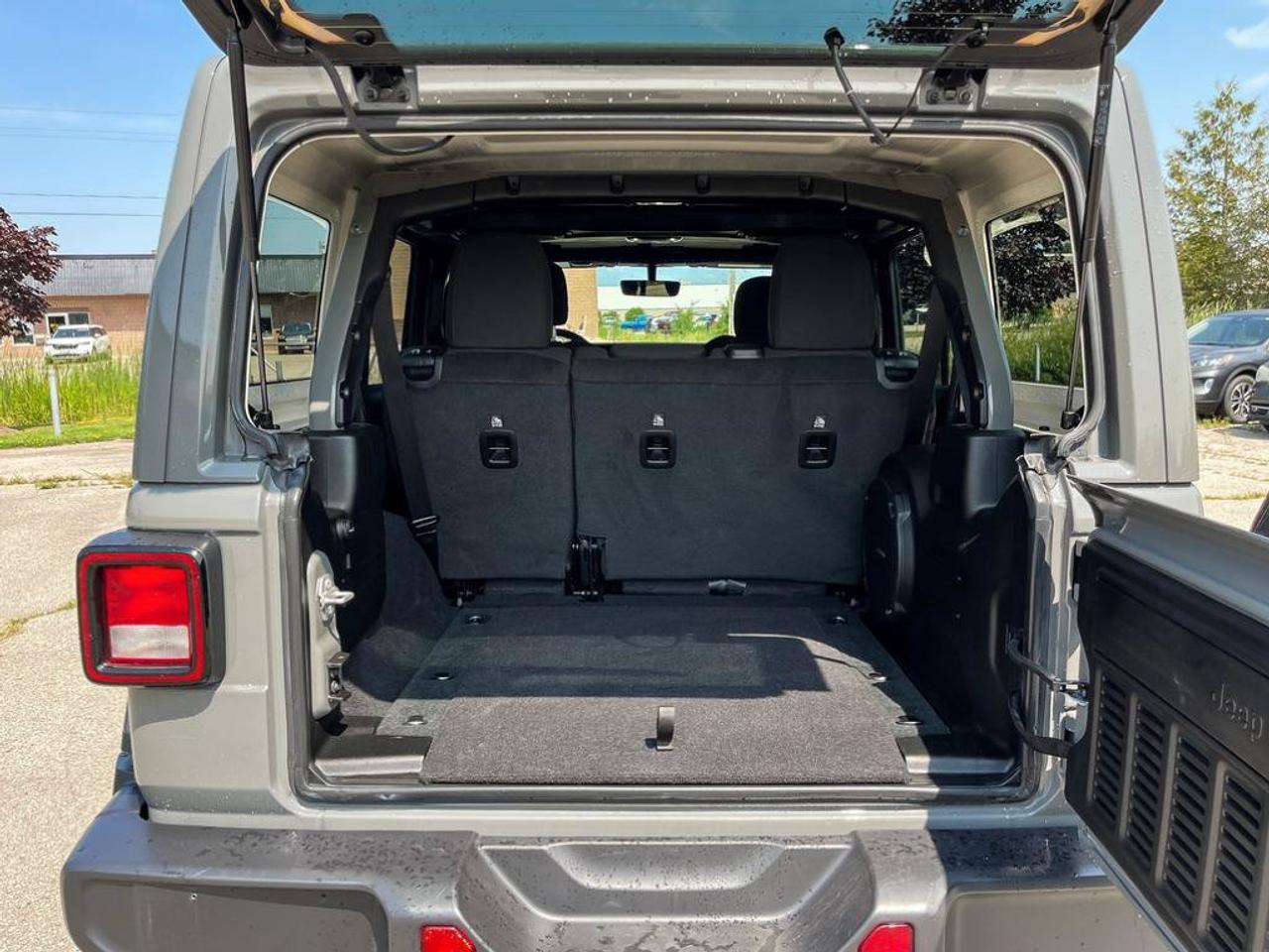 2023 Jeep Wrangler Sahara | One Owner | Clean CarFax | Navigation | Heated Seats & Steering | CarPlay | Android Auto | Photo