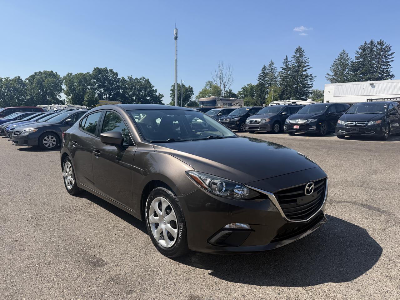 <p>Discover dependable driving and sharp style with this 2015 Mazda MAZDA3 GX, now available at Target Auto Centre. This sedan offers a fantastic combination of practicality and a sporty feel, all wrapped in a sleek gray exterior and a comfortable black interior. Its powered by a fuel-efficient 2.0L I4 engine paired with a smooth automatic transmission, making it an ideal choice for your daily commute and weekend adventures. Plus, with a clean CARFAX report, you can drive away with confidence. This Mazda3 has seen 205,172 kilometers of reliable service and is ready for its next chapter with you.&nbsp;Experience the joy of driving with this well-equipped Mazda3. Target Auto Centre is proud to offer a vehicle that balances efficiency with an engaging driving experience. Its four-door sedan design provides ample space for passengers and cargo, while the front-wheel drive ensures predictable handling in various Canadian conditions. Whether youre navigating city streets or cruising on the highway, this MAZDA3 GX is designed to impress.</p><p>&nbsp;</p><hr><p>&nbsp;</p><p dir=ltr><strong>CERTIFIED PRE-OWNED VEHICLE | BUY WITH CONFIDENCE</strong></p><p dir=ltr>&nbsp;- Ontario Safety Standards Certificate Included<br>- 30 Day / 1,000 KM Safety Warranty Included<br>- Fully Detailed Prior to Delivery<br>- CARFAX Vehicle History Report Available<br>&nbsp; (View on Our Website)</p><p>&nbsp;</p><hr><p>&nbsp;</p><p dir=ltr><strong>VALUE AND TRANSPARENCY | WHY CHOOSE US</strong></p><p dir=ltr>- Price Plus HST & Licensing Only<br>- No Additional Fees | All-In Pricing<br>- Same Price Cash or Finance<br>- Extended Warranty Protection Plans Available<br>- Autotrader Best Priced Dealer Award (2024)<br>- Competitive Market Value on Trade-ins<br>- We&rsquo;ll Buy Your Car &mdash; No Purchase Required<br>- Know Someone Looking For a Vehicle? Get a Referral Award<br>- Open 7 Days a Week</p><p>&nbsp;</p><hr><p>&nbsp;</p><p dir=ltr><strong>ABOUT TARGET AUTO CENTRE</strong></p><p dir=ltr>Target Auto Centre has been proudly serving London, Ontario and surrounding areas for over 20 years, offering over 150 quality pre-owned vehicles and a constantly updated selection to choose from. We focus on providing competitive pricing, clear information, and a straightforward buying process so you know exactly what to expect from start to finish.</p><p dir=ltr>Cars For Everyone! We offer a wide selection of vehicles to fit every lifestyle, need, and budget. Our inventory includes cars, trucks, SUVs, and vans from trusted brands such as Ford, Chevrolet, Toyota, Honda, Nissan, BMW, Mercedes-Benz, Audi, Lexus, Acura, Hyundai, Kia, Mazda, Volkswagen, Jeep, RAM, GMC, Subaru, and more. With new arrivals regularly, there&rsquo;s always something for everyone.</p><p dir=ltr>As a proud member of the Used Car Dealers Association of Ontario (UCDA), we are committed to operating with honesty, transparency, and professionalism in every transaction. Our goal is to make your vehicle purchase as simple and stress-free as possible, while delivering the level of service our customers continue to trust. Come visit us today and see why were the preferred choice for pre-owned vehicles in London and the surrounding areas. We look forward to earning your business!</p>